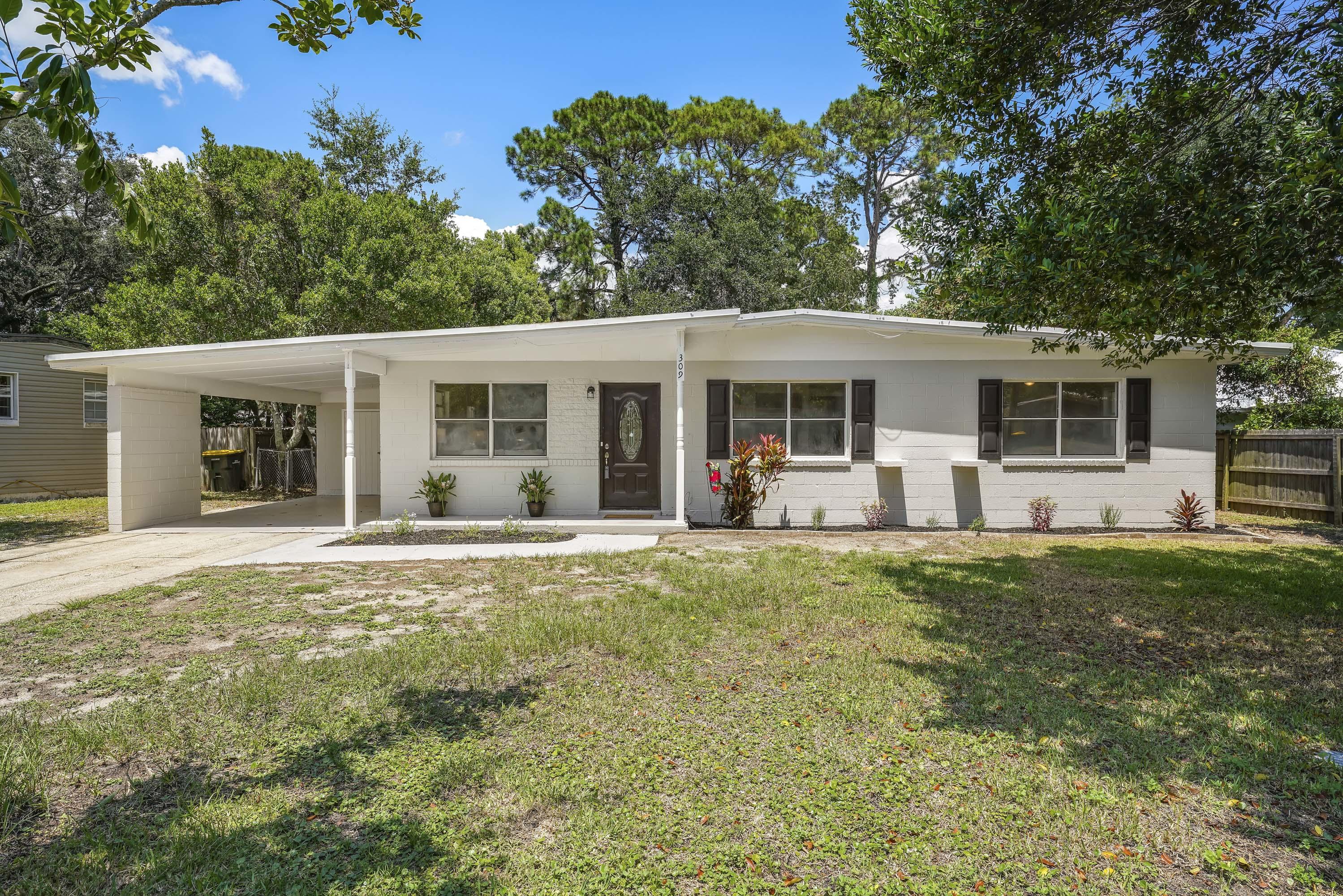 Come see this 4 BR, 2 BA, one-level home located on a quiet street in the highly desired Elliott Point neighborhood! This beautifully renovated brick home boasts an open floor plan, updated kitchen and baths, 2 new gas hot water heaters, and a new HVAC system! You will enjoy the flow and and spaciousness of this home! The kitchen features 42' shaker-style cabinets with European hinges and soft close drawers, elegant granite countertops, modern glass subway tile backsplash, and stainless steel appliances. Both bathrooms have been upgraded with new vanities, tiled shower and bath surround, and updated fixtures.