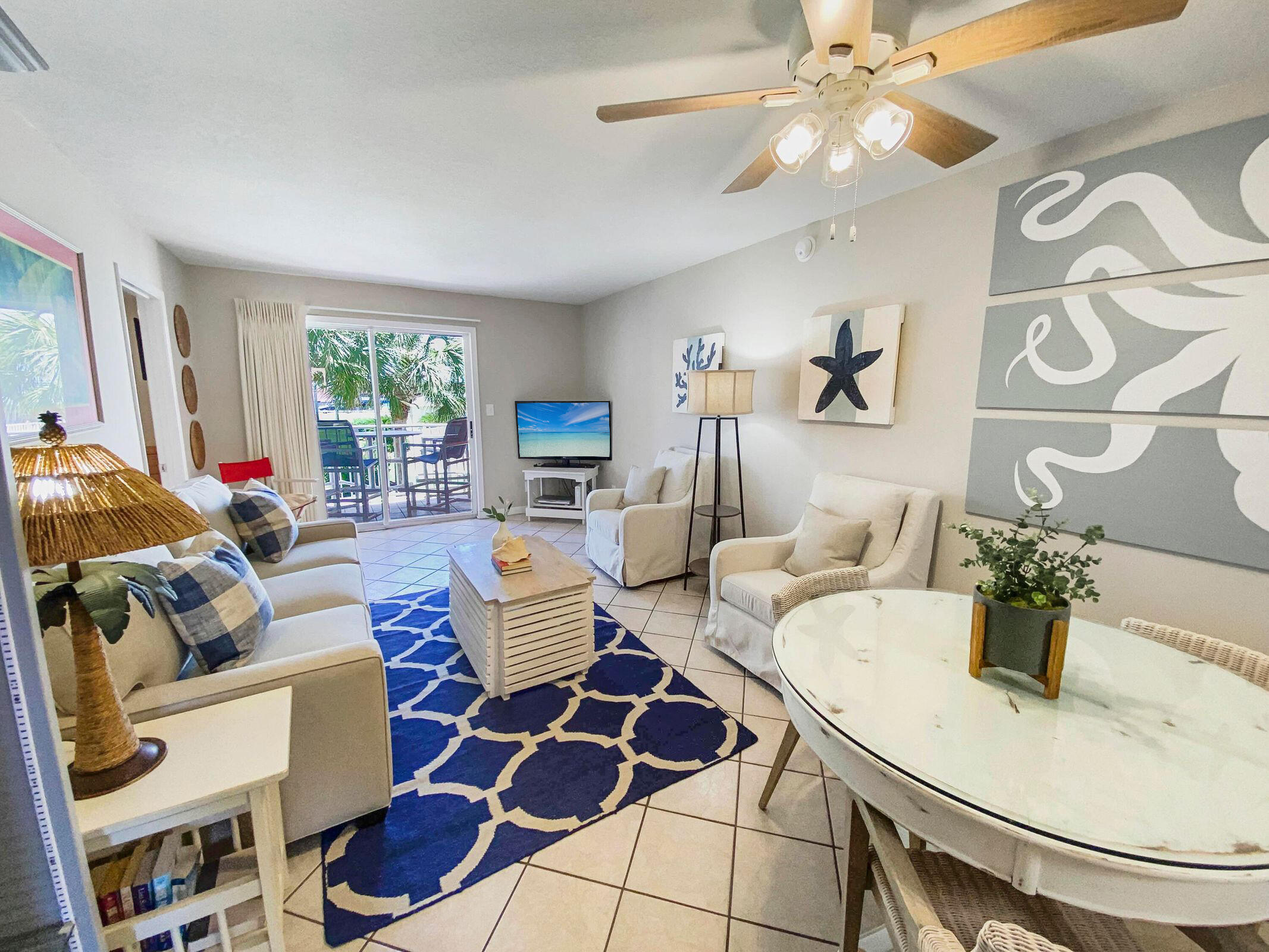 For those who love the Gulf Coast beach scene while valuing privacy and low density, this Tradewinds second floor condo delivers. The open concept features a cozy bistro-style dining area flanked by a half wall at the kitchen and a living room which opens via sliding glass doors to a wonderful covered patio. The kitchen is bright, cozy and functional with stainless steel appliances. The master bedroom also opens to the patio, and both bedrooms have a full private bath. A stackable washer and dryer make life easy and Tradewinds amenities include a swimming pool, green space, grills and picnic areas. The HOA is $505.00 per month.