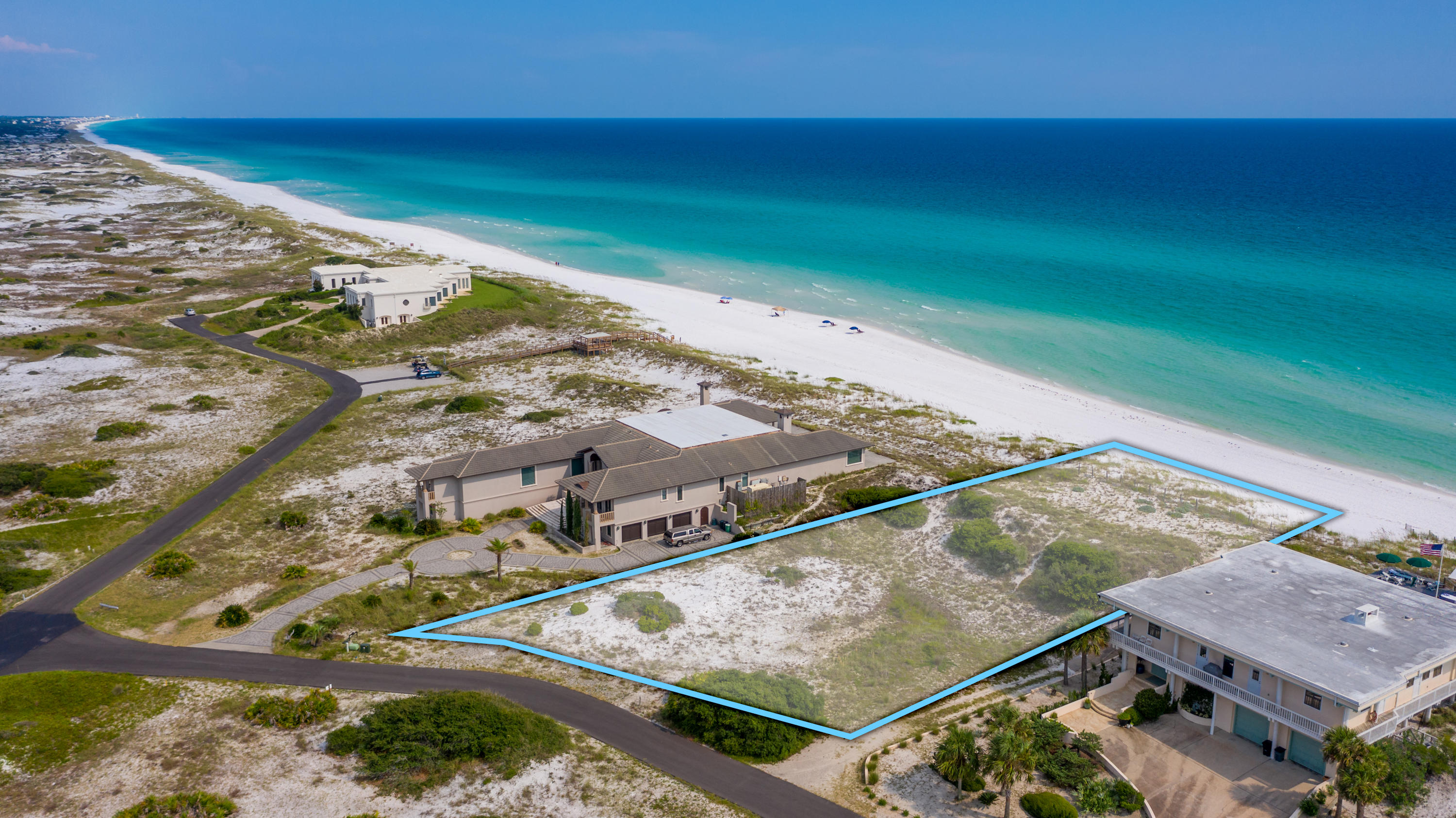 This 1.3 acre gulf front lot, with 131 feet of beach frontage, in the highly coveted neighborhood of Four Mile Village, is one of the last of its kind.  Four Mile Village is a hidden coastal paradise nestled between the Coffeen Nature Preserve and Topsail Hill State Park.  This gated community offers unparalleled privacy in a natural setting.  300 acres on nearly untouched landscape provides storybook hiking trails, historic landmarks, a coastal dune lake, and 2,200 feet of lightly traversed beach.