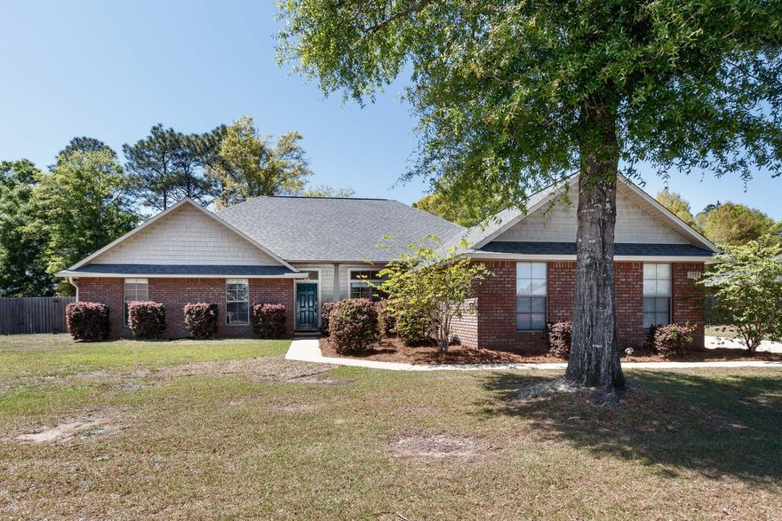 Fantastic 3 car garage home on 1/2 acre lot! Enjoy the peacefulness of country living while being in close proximity to PJ Adams Parkway and I-10. This 1 owner home has been lovingly maintained and is carpet free-- beautiful wood laminate flooring covers all living areas, with ceramic tile in kitchen/baths. Kitchen features handcrafted soft close cabinetry and granite countertops, with a functional center island. Floorplan offers 4 good sized bedrooms + formal dining room and eat-in kitchen space. Master bathroom area has dual vanities, 2 large walk-in closets, garden soaking tub, and standalone shower. This lot is fantastic and a flat 1/2 acre, with plenty of room for a future pool. Enjoy your Florida evenings in the comfort of your own backyard!**NO HOA!**