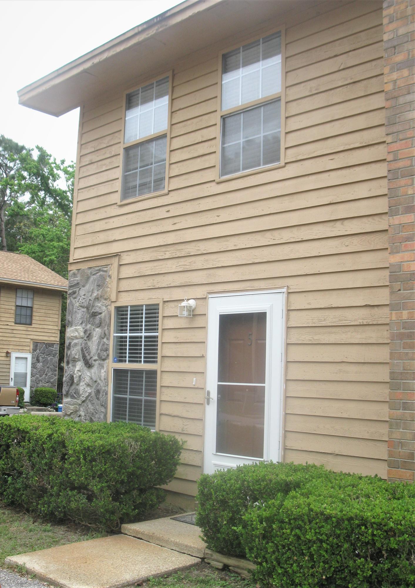 Back on Market. No fault of Seller. Brand new plumbing throughout! Beautifully renovated and updated townhouse in central Fort Walton Beach. Entire home has new ''gorgeous gray'' paint. Lawn maintenance and trash provided through HOA. First floor features tile flooring. Half bath has new cabinet and sink. Kitchen has brand new white soft-close cabinets and newer stainless steel appliances. Oversized laundry room located off of kitchen has separate outside entrance from patio. Private patio accessed through slider in dining and from laundry. Stairs and upstairs bath have brand laminate flooring. New in upstairs bath. Brand new carpet in both bedrooms located on second floor. Roof is asphalt/fiberglass and was replaced in 2005. HVAC system replaced in 2000. Buyer to verify all dimensions.