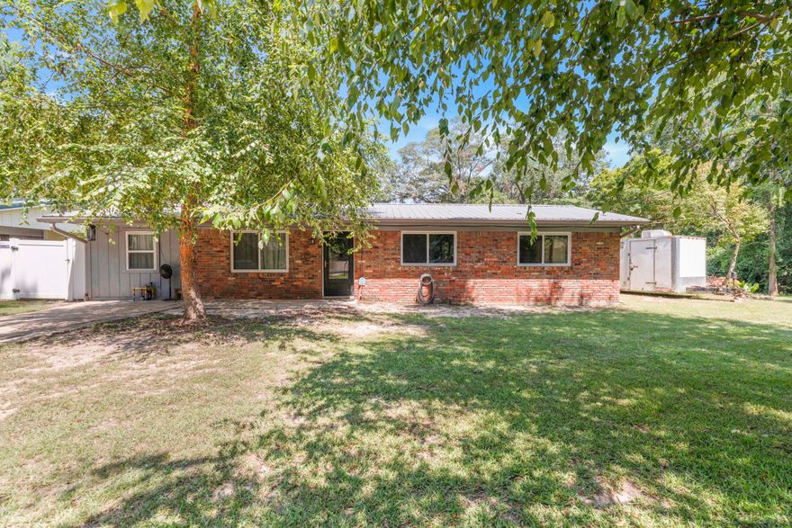 This 4-bedroom home is tucked away in the corner where Oak Ln and Magnolia Ct meet. There are two lots being offered with the home making the property almost a 1/2 acre. The yard is fenced with mature trees and a double side gate for access to the side yard. The large gate gives you the ability to utilize the 30X25 workshop with power behind the house. Approximately 14x25 of the workshop is enclosed and the rest has a concrete floor but is open. Inside you'll find freshly painted walls, and new flooring in all the bedrooms. All the spaces under roof have been enclosed to create space for a laundry room, a huge walk-in pantry, and an additional bedroom. This home is ready for someone to make it their own. Buyer to verify all info deemed important. Call for your private showing today!