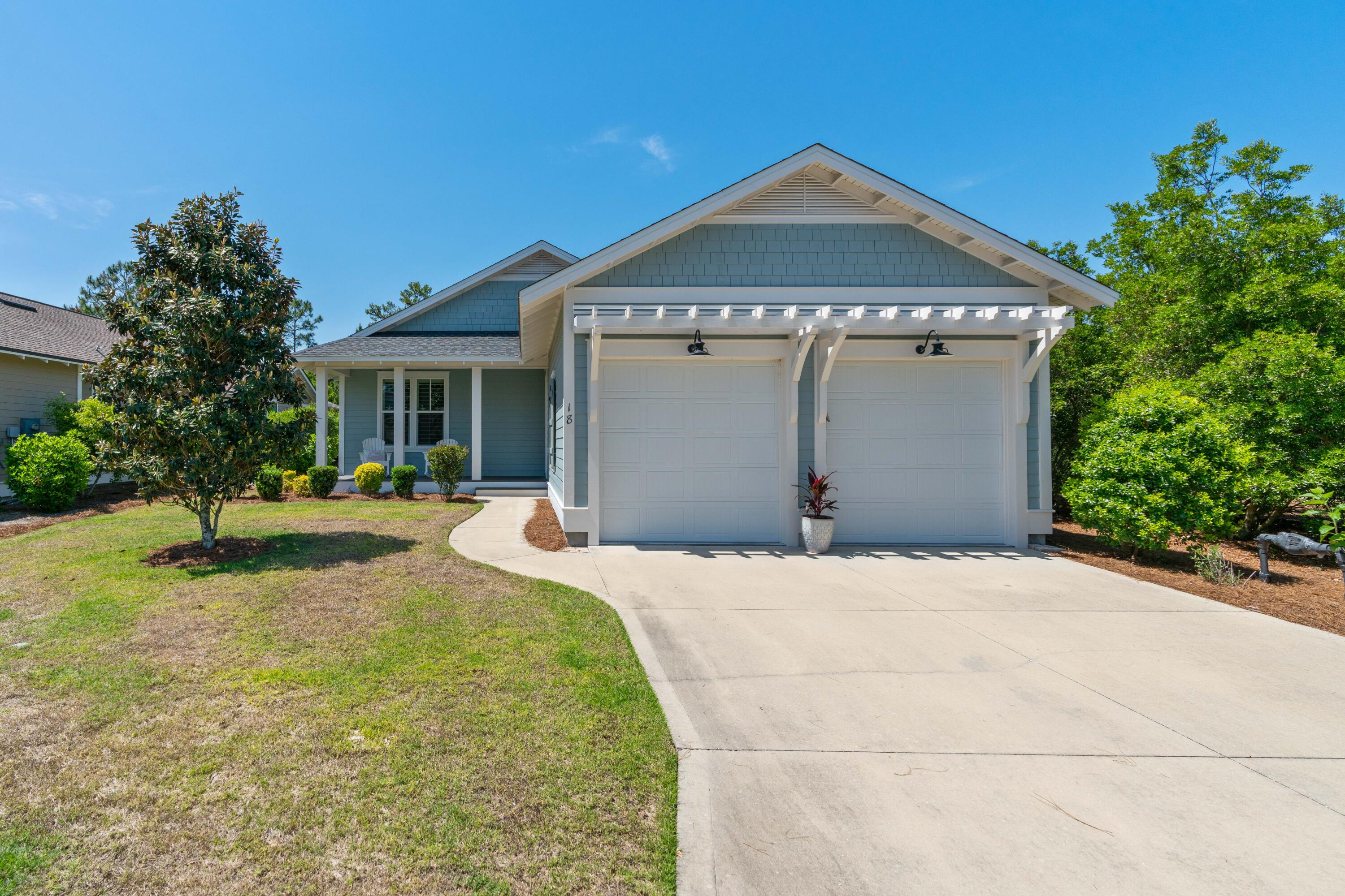 Welcome home to 18 Jack Knife Drive located in the highly desirable coastal community of Watersound Origins! Strategically positioned in a prime location on a large private lot, this fully-furnished three bedroom, three bath Florida cottage is turnkey and ready for you and your family to enjoy as a primary residence, investment property or second home. Nestled under a canopy of foliage and fauna, this 3B/3B modern coastal Florida cottage is absolutely impeccable from the open concept living/dining to the tranquil screened in back patio. This is a one of the most popular floor plans in Watersound Origins, just the right size for families, professionals and those wanting a second home in a non-rental community with abundance of amenities. A large chef's kitchen with oversized pantry and upgraded cabinetry, stainless appliances, gas range and large granite island truly is the heart of this coastal home. The custom built-in desk off the kitchen is ideal for work-from-home professionals looking to maximize every inch of this charming home.
Adjacent to the kitchen, the dining area with a large farmhouse table and seating for eight makes this home ideal for entertaining family and friends. Two fully furnished, well-appointed private bedrooms, each with a private ensuite baths and large closets are perfectly positioned within the home to accommodate families and overflow guests. The spacious primary bedroom located just off the living area includes a separate shower, soaking tub, double vanities and large walk-in dressing closet that makes for a perfect primary coastal retreat. Just under 2,000 square feet, this impeccably maintained home with two car garage boasts ample indoor/outdoor living area and is turnkey ready for immediate enjoyment. High-end furnishings and d??cor from Pottery Barn and local home furnishings boutiques add to the coastal charm.Additional highlights of this home include custom-plantation shutters throughout, surround sound system, upgraded corner lot premium, two-car garage with extra storage nooks and epoxy floor finish, ample attic storage. The perfect entertaining home, you'll enjoy dining al fresco and entertaining guests overlooking the lush backyard conveniently located a short distance to miles community walking trails, golf course, tennis and abundant amenities enjoyed by residents of the Watersound Origins. WaterSound Origins provides residents with an impressive collection of amenities including the Village Commons pools and fitness center, tennis courts, pickle ball courts, complimentary kayak and paddle boards at the Lake Powell access, and the opportunity to join the famed WaterSound Club which offers an even larger array of exclusive amenities. Origins is also geographically poised minutes from the white sugar sand beaches and all of the world-class dining and shopping venues 30A has to offer. The WaterSound Town Center located in the front of the community hosts weekly Farmers Markets and will be the future home of a Publix in addition to shopping and dining options.
