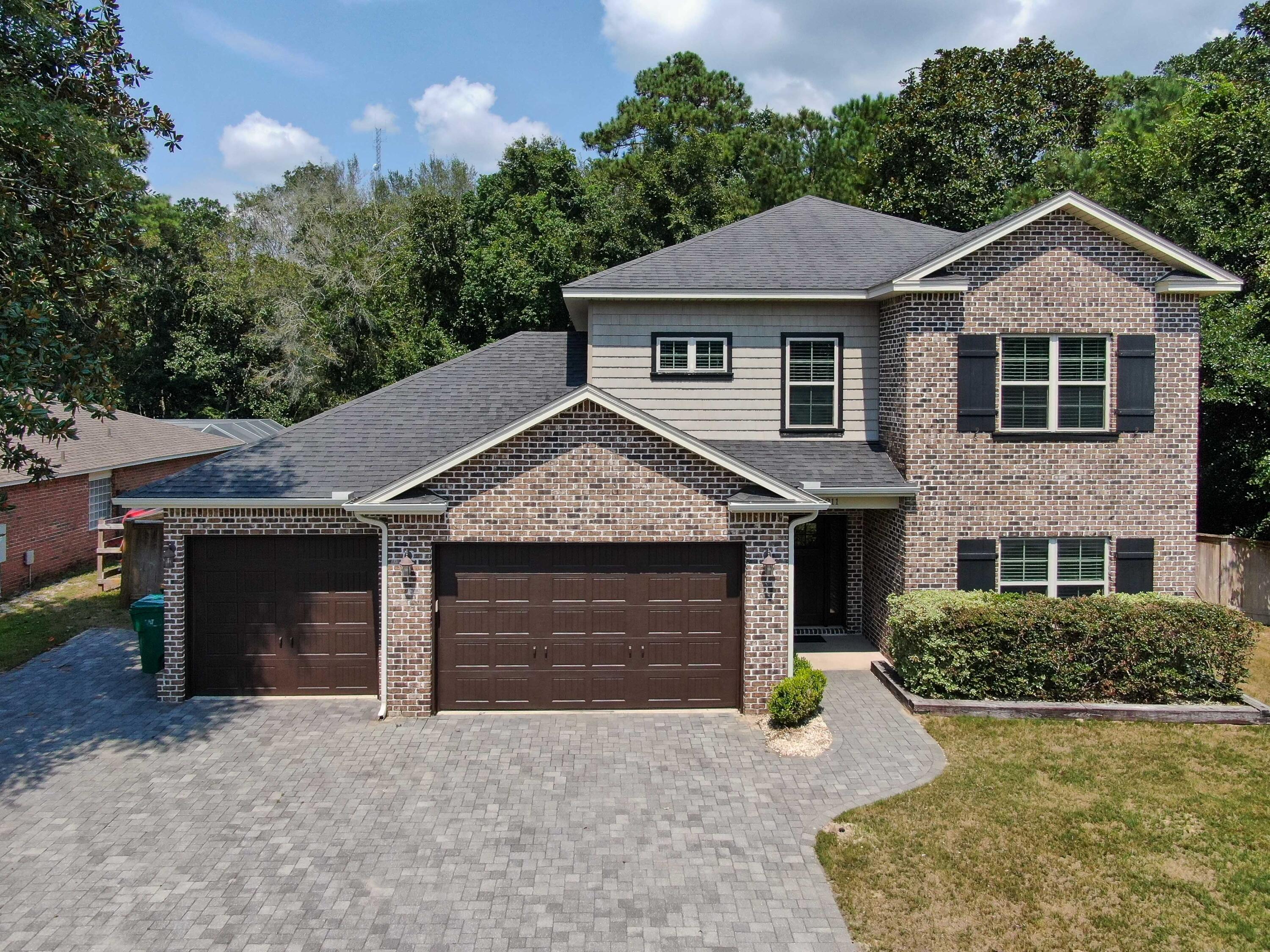 This meticulously maintained four bedroom, three bath home with a heated and cooled bonus room is located on a large lot for added privacy. Downstairs is ADA accessible. The home features 10 ft ceilings throughout, including the three car garage, Temperpedic padding underneath all carpeted areas, Cambria quartz countertops, Schrock soft close cabinets, Blanco Sile granite sink in the kitchen, engineered wood floors, Rheem instant hot water heater and has been spray foam insulated throughout. The bonus room is heated, cooled and plumbed with a private entrance, perfect for a studio apartment, workout room or theatre. The kitchen is equipped with a gas stove and also has an exterior gas line for a grill. Custom home built by John Tidwell. All information and dimensions are deemed to be
