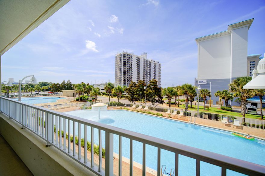 Gorgeously updated corner unit with a wraparound balcony overlooking the refreshing pool. This spacious condo offers tons of natural light and features designer-selected furnishings that create a refined, coastal ambiance. From its clean lines to its serene color palette, every detail has been thoughtfully curated to evoke the feel of a luxurious beachside escape. Turnkey and stylish, this is your own slice of paradise, just steps from the sand. This one's a must-see and definitely checks all the boxes.