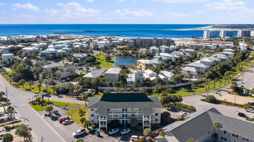 Come enjoy the coastal lifestyle of Holiday Isle! This updated unit is MOVE IN READY! This spacious 1 bedroom, 1 bathroom condo comes fully furnished and is located on 1st floor with a balcony. The unit features granite countertops, new tile floors and solid wood cabinets. You will be walking distance to the community's gated beach access and the inlet of the East Pass at O'Steen Beach. You don't want to miss the seasonal Emerald Grand fireworks from your balcony and access to watersports, shopping and restaurants at the Harbor via water taxi at Norriego Point! LOW HOA dues and amazingly rents short term, long term or utilize it yourself! This unit won't last long!