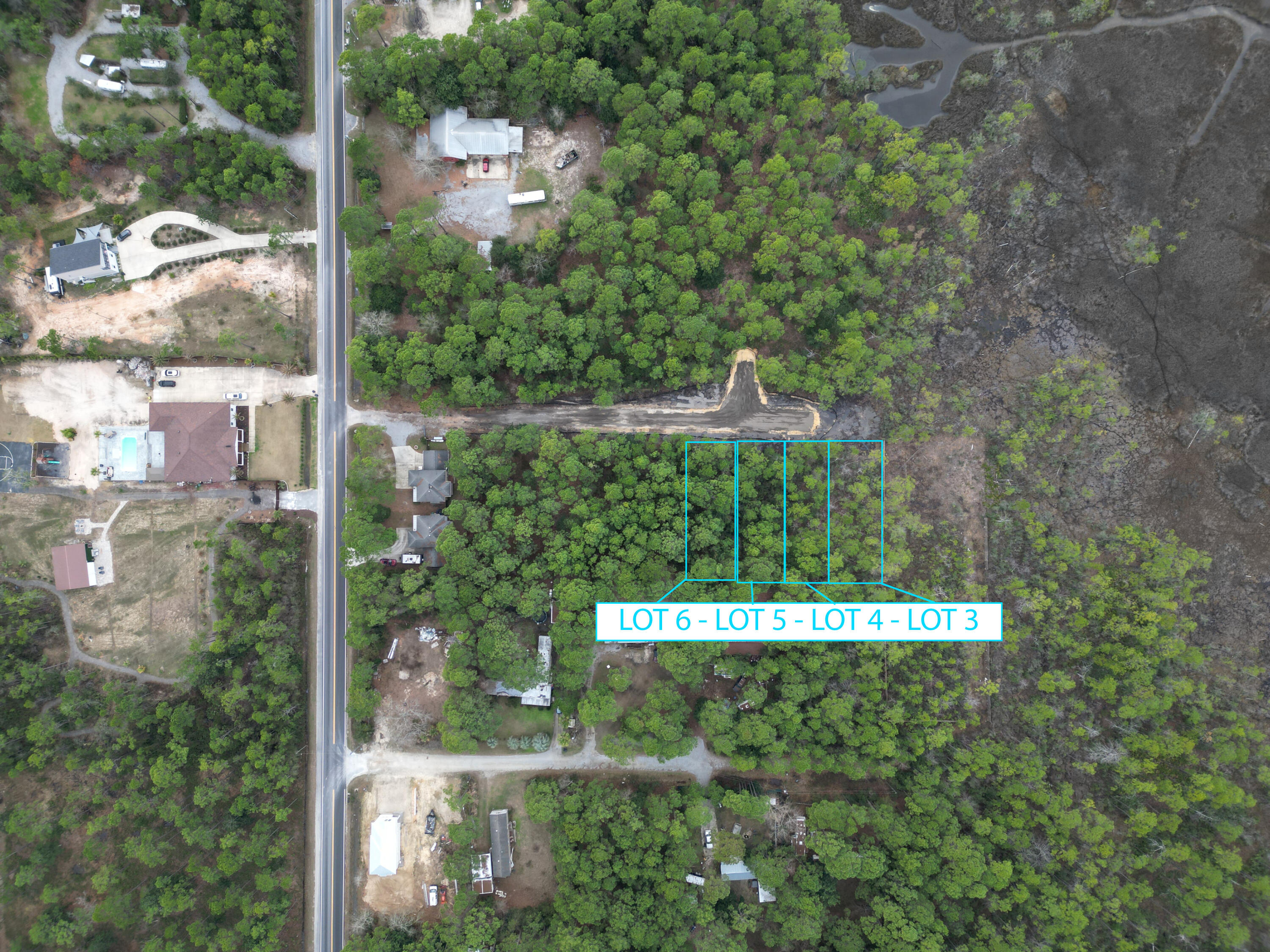 PHASE 3 Homesite PRESALE Introducing an exceptional opportunity to purchase Lot #4 nestled along Churchill Bayou Road: Lot #4 will be offered with the convenience of county water and sewer. Situated in a peaceful setting off the Churchill Bayou.Encompassing 0.14348 acres, 50x125 6,250Sqft lot, this Homesite offers a canvas for crafting your dream coastal retreat. Fantastic opportunity whether you are inspired to build a quaint seaside cottage or a modern architectural masterpiece. Home Renderings shown are for inspiration purposes only.(Floor plan is property of architect. Proportions will need to be adjusted to 25 X 40 feet long. The perspective gives the impression to scale within the wooded conservational zoning and setting.