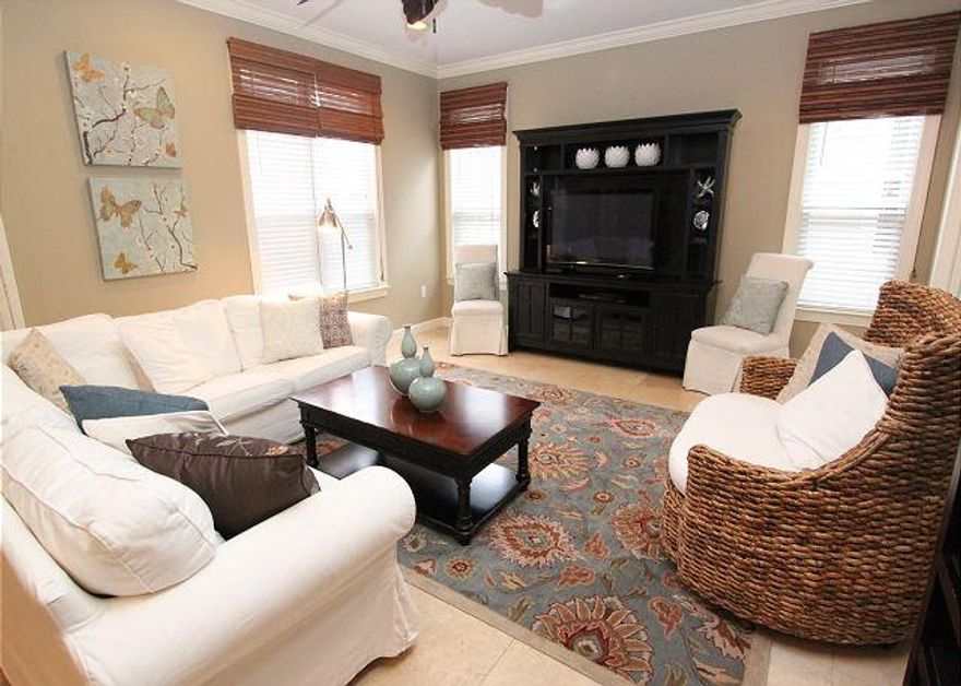 Beautiful home inside & out, 2nd largest floor plan in Crystal Lake Phase 2. Completely updated w travertine & hardwood floors throughout, granite & stainless in the kitchen, with lovely new furnishings to convey. The large downstairs master suite has a king bed, master bath has a separate shower, garden tub, double sink vanity and a very large closet. Two oversized gorgeous upstairs guest bedrooms, 1 w/a king bed the other w/a queen. There is an upstairs niche with a charming twin bed, privacy curtains & a small office nook. There are 3 patio/deck areas, one is screened with privacy curtains. Owners are selling the 6 seater golf cart- $4000. Buyers are responsible for verifying measurements, dimensions and fees. 2015 HOA $270/mth & SOA $362/qtr. Property produces vacation rental income.