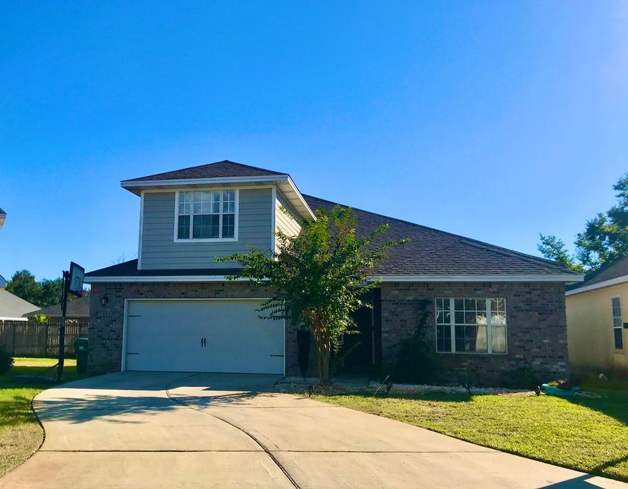Brick and Hardi home built in 2012, features open floor plan downstairs with 9ft ceilings. Granite Countertops and tiled floors in kitchen and dining areas, with stainless steel appliances. Trey ceiling in dining room. Master Bedroom on 1st floor, cultured marble garden tub, marble surround separate shower & marble double vanity in Master Bath. Master bedroom closet has extra storage area for safe keeping your important items! An additional living space on the 2nd fl would make a great family room or tv room for kids. HOA fee includes yard cutting and street lights. Large deck in the back is perfect for BBQ's. Planter Beds ready for your veggies or herbs!