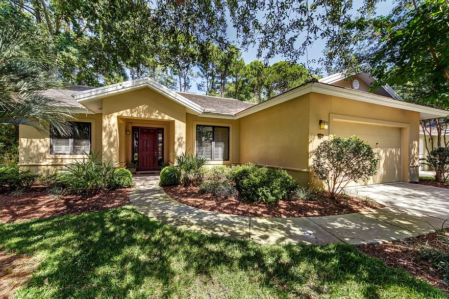 Wonderful completely updated single story home with a large 2 car garage. Being offered fully furnished including all appliances with two refrigerator/freezers and a fully stocked kitchen. (some exclusions apply) It sits on a very private and well landscaped lot that overlooks a nature preserve. There is even a stream that runs through the back edge of this lot that can be viewed from the beautiful and large screened lanai and the red wood backyard deck. This home has many custom features such as a smart lighting system that controls the interior and landscape lighting, built in sound system, heavy crown moldings throughout, arched doorways, plantation shutters, and porcelain tile floors throughout with the exception of carpet in the bedrooms and natural cork flooring in the kitchen.