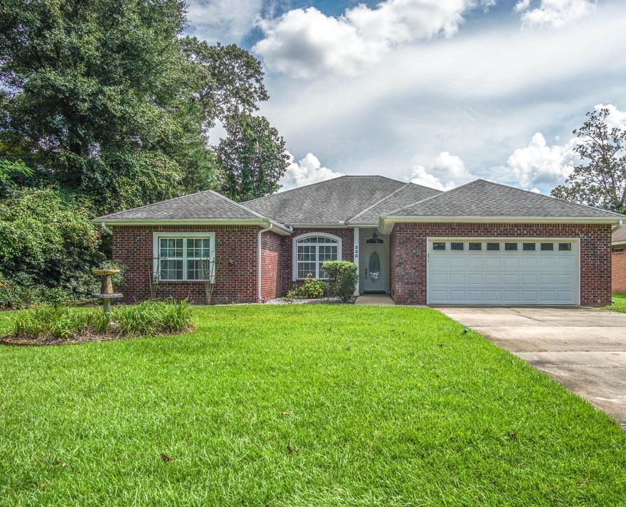 This beautiful pristine brick home features a large open floor plan with all custom-tile flooring. Upon entering this 2300 plus sq.ft. home, you'll notice large windows which provide tons of natural light and a feeling of openness. There are formal dining and living room areas for entertaining guests. The kitchen has custom cabinetry with abundant storage space and a breakfast bar for morning coffee or tea. Solid-surface counter tops, a stainless-steel refrigerator and a new Bosch dishwasher (2018) are some great featured upgrades of this kitchen. Open to the kitchen is a family room which offers a cozy corner fireplace and is wired for surround sound. This 3Bed/2Bath split plan offers a spacious Master Bedroom/Bath with separate cultured-marble vanities and windowsills, trayed ceilings, a large whirlpool tub, separate shower with seat and large walk-in closet. Master also has direct access to back yard. There is ample closet space in all bedrooms and a large laundry room. In the evening, enjoy your spacious, covered patio with fenced backyard. This .26 acre flat-lot has grape vines, mature peach, fig, lemon and tangerine trees and there is plenty of room for a pool or vegetable garden as well. Front yard has irrigation system. Located in central Crestview, you are only a short distance from shopping, restaurants, Bob Sikes school, theater and will enjoy an easy commute to Eglin AFB, 7th Special Forces Group and the area beaches. BEST OF ALL THIS HOME IS MOVE IN READY!!! New in 2018 Rheem Hybrid, high-efficiency water heater and Nest carbon monoxide/smoke detector. New in 2016 Nest thermostat.