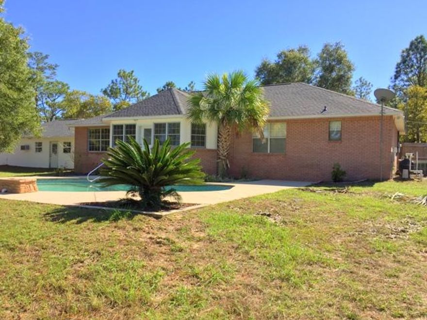 Lake Front Oasis with Pool & New Roof! Tucked away from all the hustle & bustle... this 3 Bd / 2 Ba home is situated on approximately 1.66 acres with over 200 feet of lake front. The open floor plan offers a wide foyer entrance & the kitchen has breakfast bar with tons of cabinet & counter top space. Double french doors lead to a Florida Room which offers views of the pool as well as the lake. The spacious master suite offers double vanity. The exterior features will not disappoint... detached garage / workshop, separate storage shed & of course the in ground pool. Call us today to see this must see home! Please view the 3D Tour with the following link: https://my.matterport.com/show/?m=FfShjB9qdGZ&mls=1.