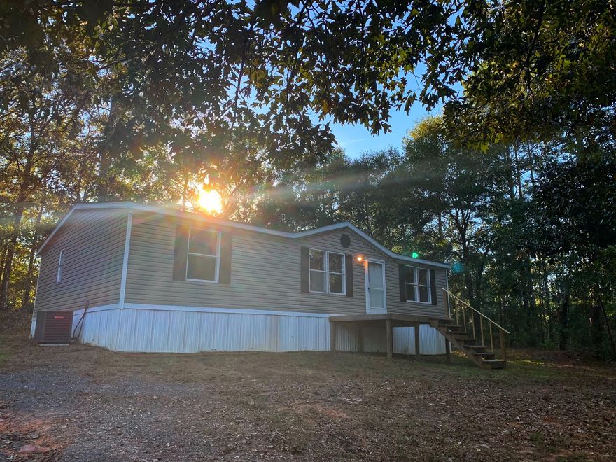 Manufactured home on over 3 acres! 3 bedroom 2 bath home has been recently remodeled. New AC, paint, trim, flooring and deck. Schedule your showing today! All measurements must be verified by buyer.