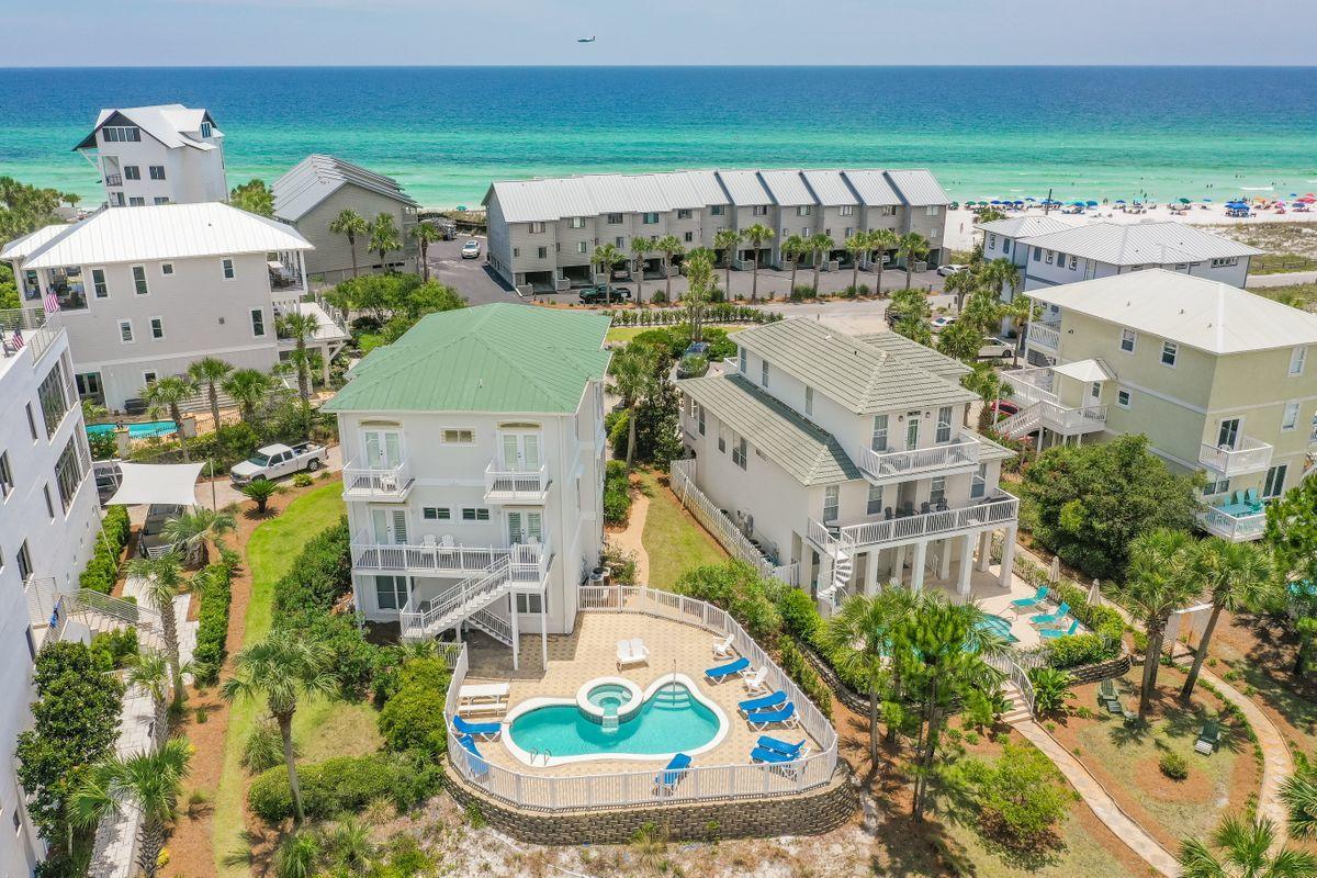Renovated in 2017, with the exterior painted in May 2020, this amazing home situated steps to the beach and on a lake in Seagrove Beach, FL, is a prime vacation getaway along Scenic 30A with spectacular Gulf views. Projected to gross over $182,000 in rentals. Renovations include: new flooring on 1st & 2nd floors, new furniture in living room and most bedrooms, new lighting fixtures, new kitchen appliances, kitchen countertops and cabinets, four new bathroom vanities, bathroom toilets and hardware, shower doors, outdoor railing on 2nd and 3rd floor decks, 2nd floor deck flooring, driveway pavers, landscaping, paint inside and outside, gutters, and TVs. This home includes a heated pool and spa, two-car garage and Gulf views. Plenty of parking spaces with overflow in the cul-de-sac center.