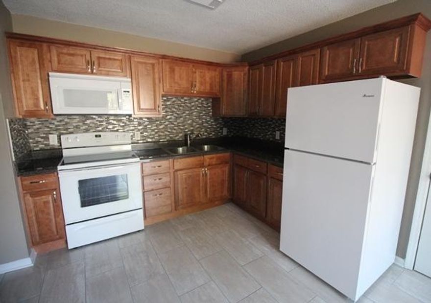 Affordable 4 bedroom newly re-modeled home.......will go fast! New features include, carpet, tile, cabinets, counters and appliances. This home is cozy with a very spacious layout. Must see!