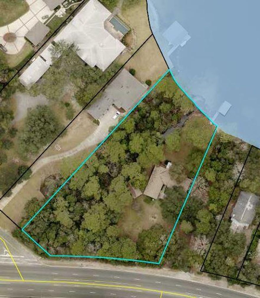 1.64 Acres waterfront. There is a home on the property but the price is based on land value.  The home is beyond repair and being sold as-is.