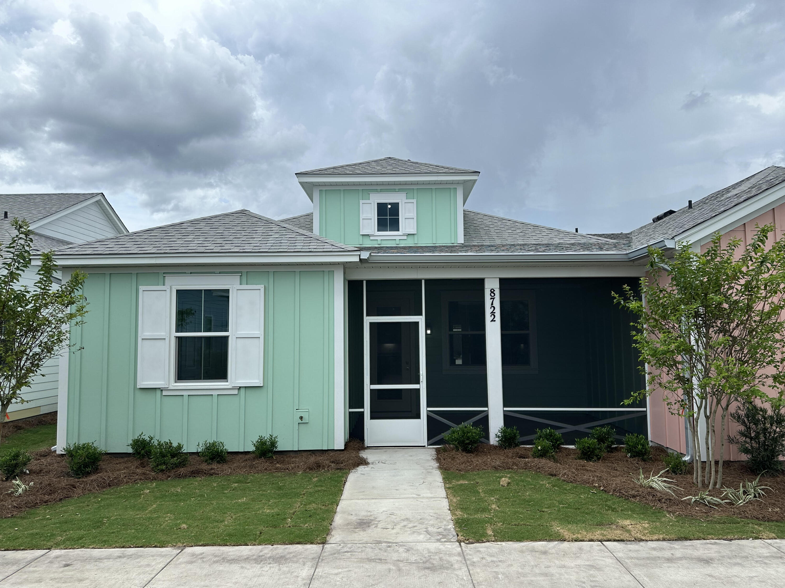 Offered at an incredible price, this brand new ''Camelia'' cottage home is located in the amazing adult, 55+ community of Latitude Margaritaville Watersound. You've wanted a neighborhood with great people and great amenities; and you have found it here! A place to call home where you can have casual strolls in a gated community or get as involved as you want to with fun, energetic people who know how to have fun! First-class amenities await in Margaritaville where you can relax by the pool, dine at their amazing on-site ''Bar and Chill'' restaurant, or get your workout in with their large gym, pickleball or tennis. Whether attending weekly concerts at the onsite amphitheater or just taking your dog to the large dog park - Barkaritaville - there are amenities for everyone. The Camelia home is a two-bedroom, two-full bath, 1320 sf home that pairs up next to a Dreamsicle cottage home; superior sound proofing construction make it a quiet neighbor. This home comes with the builder warranty with Master Care and is LOADED with options including things like 8' interior doors throughout, recessed lighting throughout, Rinnai tankless gas water heater, extended island in the kitchen, undercabinet lighting, impact resistant energy efficient windows, Taexx?? pest defense system, and many more too numerous to list! See the documents for a complete list of structural and design options added to this home. This home is under construction with a planned close date of August 29, 2024; the first day you could close with purchase. This was to be the retirement home for the seller, so they put many upgrades into the home; a change of plans is causing the sale. The lifestyle at Margaritaville is incredible; you have found your home here and come be a part of this amazing community all at a great price! Just seven miles from the world's most beautiful beaches and right next to the intercoastal waterway, your paradise awaits!