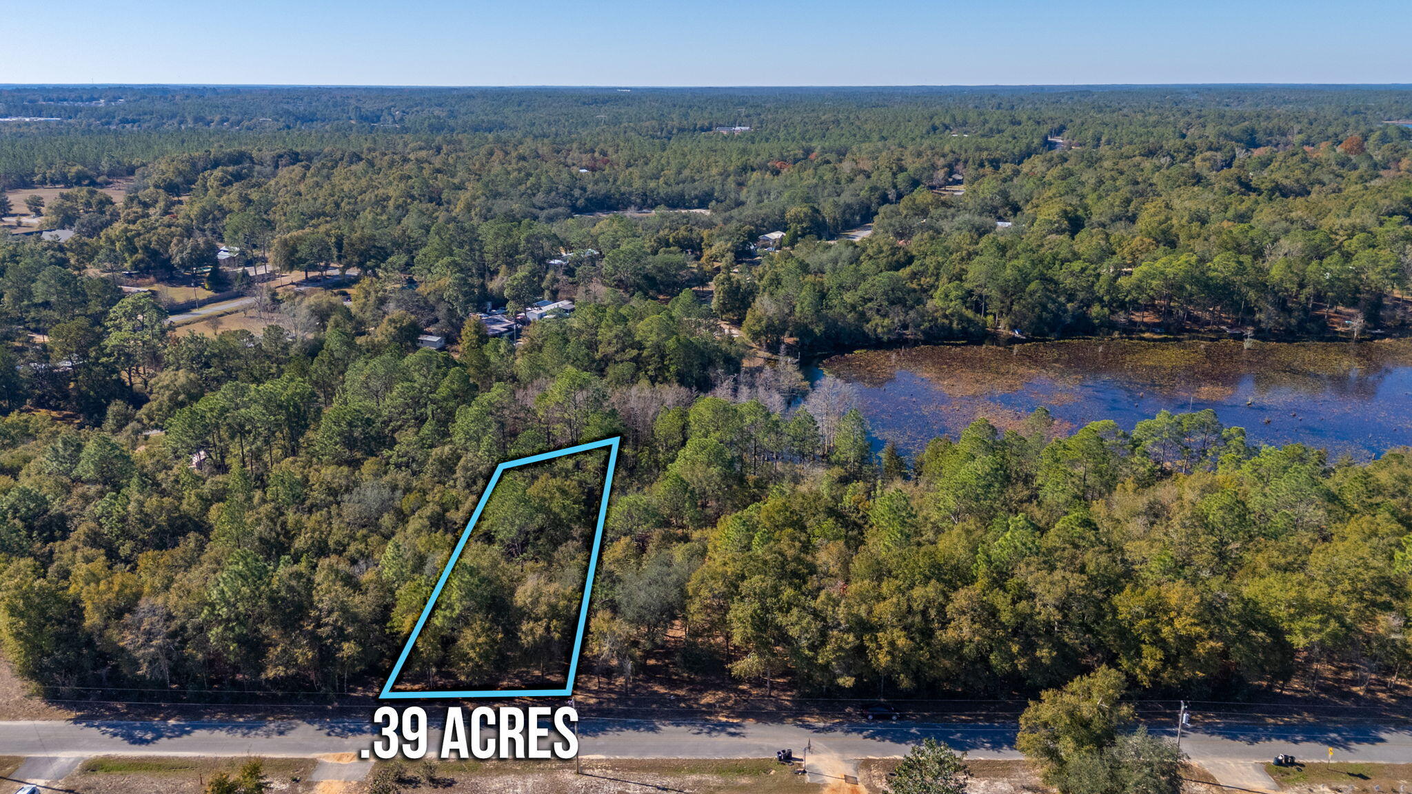 Discover the perfect canvas for your waterfront retreat on this .39 of an acre lot nestled on Juniper Lake. Recently surveyed and professionally mulched, this property offers a clean, open view, making it easy to envision your future plans. With no HOA fees or restrictions, you have the freedom to design and build your ideal space without limitations. Power & public water are easily accessible at the street. A septic system would be needed. Enjoy direct lake access for tranquil mornings, vibrant sunsets, and endless recreational opportunities like fishing, kayaking, or simply soaking up the natural beauty. The adjacent .40 acre lot is also available for purchase, offering an incredible opportunity to expand your lakeside haven.