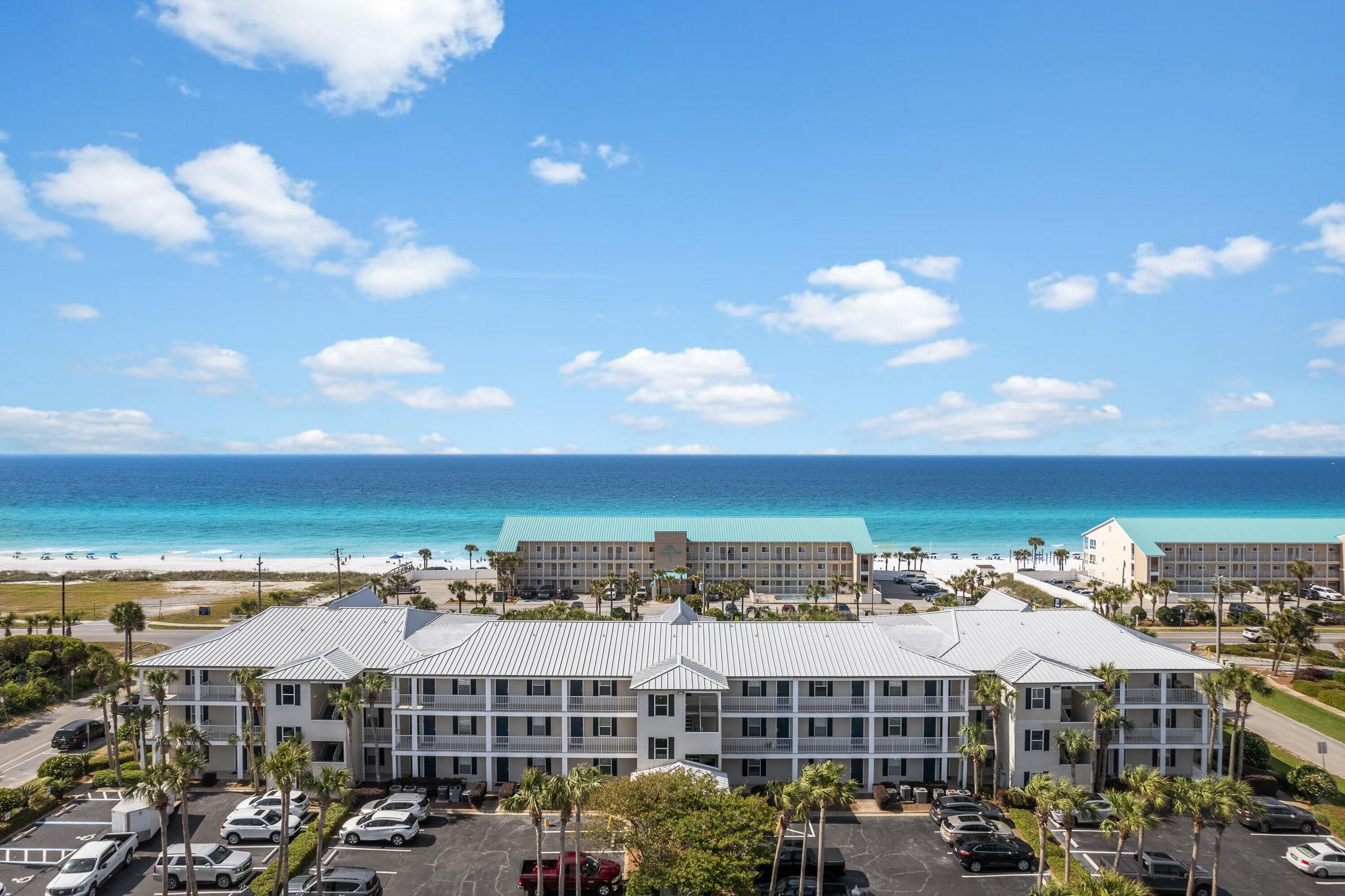 PRICED TO GET YOUR ATTENTION! Treat yourself to the coastal vacation property you deserve in this delightful 1-bedroom, 1-bath rental condo with unobstructed Gulf of Mexico views!   The Grand Caribbean East complex is just a short distance from the white sandy beaches.  This is an ''END UNIT'' with an ''L'' shaped balcony to enjoy. Inside is a vibrant, open-concept interior that invites you to relax and unwind. Play games or watch movies in the living area or prepare a sumptuous feast in the fully equipped kitchen with a multi-seat island. French doors open to a scenic balcony ideal for nightcaps while enjoying majestic Gulf of Mexico views. Also, a washer & dryer is in the unit. Must see to appreciate! The bedroom, hall bunk beds, and pull-out sofa are all fitted with brand-new bedding, along with fresh bath towels in the shared bath. The bathroom and kitchen were renovated in 2022 with new cabinets, appliances, vanities and countertops. 
Embrace the variety of amenities available, including the pristine pool and spa, a picnic area, and easy access to the beautiful beach and closeness to the local attractions. Additionally, there's a storage closet by the door, ample outdoor parking, and a facility-wide security system.
