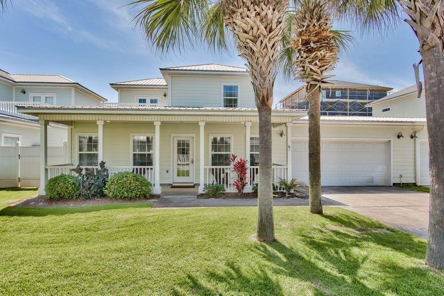 Nestled on this sweet little lane of only a few townhomes is a great rental income producer or primary home just two blocks to the beach with a two car garage, community pool, and fenced backyard. Conveniently located to restaurants & shops. The garage affords opportunity to offer a golf cart and bikes to renters increasing rental potential. In 2019, the owner grossed $44K in rental income and rented himself on VRBO.