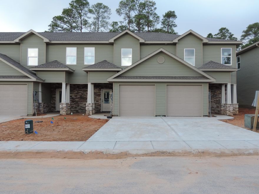 Estimated completion is November 2021. 1700 is an end unit in these Luxury craftsman style townhomes. Built to the latest building and energy codes helps both on insurance as well as power bills. The location is a short distance to Hurlburt, as well as Gulf Breeze. Navarre Beach and Pensacola Beach are short drives as are shopping, and dining options. The home features 3 well sized bedrooms, 2 full bathrooms and a powder room is located conveniently on the main floor. The main floor features an open floor plan. The kitchen features granite countertops, and stainless appliances. Luxury vinyl plank flooring is throughout the home, so cleanup is easy. Upstairs the master suite is located to the back of the home with large walk in closet and double sink vanity.