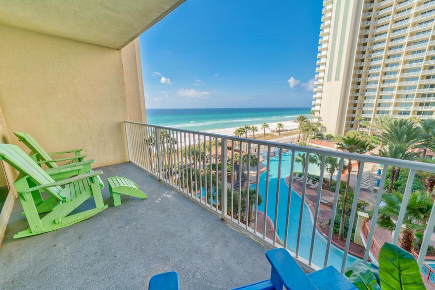 Wow! Desirable 5th floor unit with its own deeded parking place. This unit is rental ready, beautifully decorated and on the east side of the building so the sunset views are awesome! The Shores of Panama condominiums are known for its resort style, lagoon pool area complete with hot tub and Two Tiki bars. The other amenities include indoor heated pool, spa, onsite fitness center, sauna and steam room, market and onsite security. This complex lends itself to some very nice rental returns. The location of The Shores is wonderful too! Easy proximity to shopping, restaurants and entertainment. You barely need to leave the complex. Nice investment piece ~ come check it out!