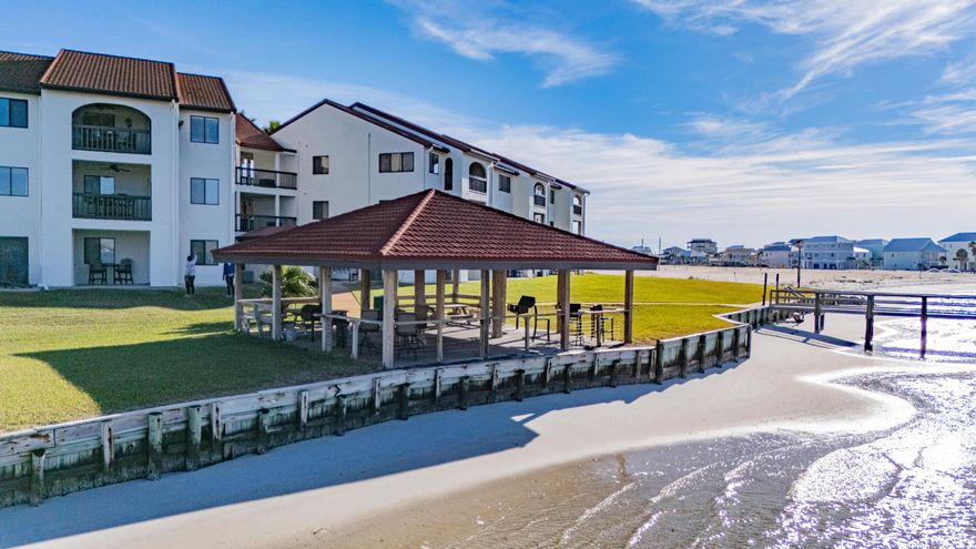 Waterview condo on Navarre Beach in The Palms of Sunset Harbor perfect as your personal getaway or investment property! Wake up in the morning to the beutiful views of the Santa Rosa Sound and enjoy the day relaxing poolside. This unit offers fully open layout with the bedroom connected to living room right off the full sized kitcen. Full bath offers a beautiful walk in tiled shower. Enjoy the amenities ongrounds including: Private Beach, PoolFishing, Pavillion/Gazebo, BBQ/Picnic areas and more! Across the street from the beautiful white sands of Florida's 'Best Kept Secret' Navarre Beach.