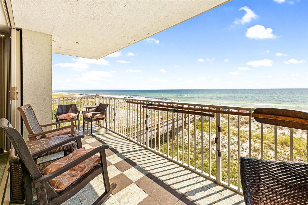 Condo back on the market due to no fault of the seller. Their loss is your gain!Welcome to your little slice of PARADISE!  This completely renovated, never-before-rented gulf front condo is ready for your personal touches and furnishings. As an end unit, with a wrap around balcony, it offers the ideal retreat where you can unwind to the sound of the waves rolling in.  With modern upgrades in every room, this spacious 1310 sq ft condo features two bedrooms with ensuite bathrooms, built-in bunkbeds in the secondary bedroom, a custom kitchen with butcher block counter tops, and breathtaking gulf views. Though the interior is less than two years old, the entire building is set to undergo a full renovation, bringing everything up to the same exceptional standard.  When touring this beautiful condo, be sure to go to the 7th floor to check out the roof top pool and work out facility.  THIS UNIT IS BEING SOLD UNFURNISHED.  Please call the listing agent to schedule your showing today.