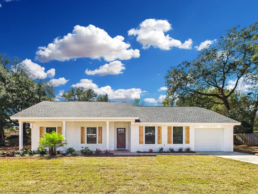Completely Renovated Home with Modern Charm and No Stairs! Step into this beautifully reimagined home, completely renovated down to the studs, offering a new effective year built of 2023. Thoughtfully designed with a split floor plan featuring two master suites, this single-story gem is move-in ready. The primary master suite boasts a dual vanity, soaking tub, separate walk-in shower, and a spacious walk-in closet, while the second master suite offers a sleek walk-in shower--ideal for guests or multi-generational living. From the inviting white brick exterior with natural shutters to the charming front porch, perfect for rocking chairs and morning coffee, this home blends timeless style with modern conveniences. Inside, you'll find new windows, matte black hardware, recessed lighting, and an electric fireplace with a raised hearth and mantle. The heart of the home is the designer kitchen, featuring pendant lighting over a large island with deep drawers, a breakfast bar, and ample storageincluding floor-to-ceiling pantry cabinets. A French door refrigerator and stainless steel appliance package complete the space. Additional highlights include a garage with epoxy floors and opener, pull-down attic stairs, tankless water heater for endless hot water, indoor laundry room with a drop zone and a freshly sodded yard for easy outdoor enjoyment. This home offers modern luxury with no detail overlooked. Schedule your private tour today!