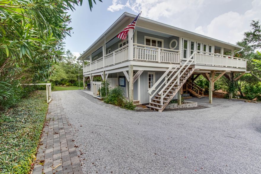 Charming beachside home located steps to the sugar white sands and emerald green waters of the Gulf of Mexico! This one-of-a-kind property offers privacy and tranquility rarely found on 30A. Situated less than three-quarters of a mile from Alys Beach, this home offers quick access to everything the area offers including world-class dining, luxury shopping, and extraordinary outdoor activities. Gated beach access is found less than 500 ft from the front door. Features of the property include an open concept living area boasting an airy cathedral ceiling; chef's kitchen with large island; separate private guest quarters; an oversized private pool; astounding custom wood craftsmanship throughout; beautiful wood beams; stunning hard-wood flooring throughout; abundant amounts of covered outdoor