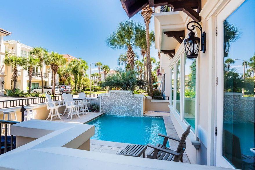 Beautifully constructed and pristinely designed, this stunning beachside villa is one of the only recently built homes available located in the heart of the exclusive gated enclave of Destiny by the Sea. Recently updated with professional designer decor, this modernized and spacious home offers every desired amenity at the beach including finely appointed finishes while presiding prominently just a few tiers off the Gulf of Mexico. This property has excellent second home and income potential with rental projections exceeding $100,000 annually. This thoughtfully designed home is characterized by an open floor plan offering ample indoor and outdoor living space including a private pool with walled privacy steps from the deeded community beach access. The first level features a spacious master bedroom suite and ensuite bathroom compete with soaring glass windows that overlook the tropical courtyard pool area. The expansive great room is the anchor of this well designed home and is ideally located on the second level creating a harmonious living space that occupies the second floor. The main living area is open to a sizable dining table adjacent to the well-appointed chef's kitchen complete with beautiful stone countertops, custom wood cabinetry with ambient lighting as well as the latest stainless appliances. The third level offers a secondary master suite complete with a spa-like ensuite bathroom. There are two additional bedroom suites occupying the third floor each offering ample space as well as ensuite bathrooms. This property would make an exceptional second home or vacation rental offering excellent amenities including close proximity to the community resort-style pool and clubhouse and steps to Destiny by the Sea's exclusive beach access. Destiny by the Sea is centrally located in exceptional proximity to world class restaurants, shopping, golfing, boating and local entertainment.