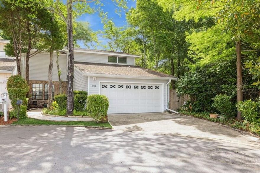 Quiet and Convenient.  End unit in the most desirable spot in the neighborhood!  Located at the end of the cul-de-sac and bordered by a greenspace easement.  These homes were designed for privacy & seclusion.  Convenient to everything from medical care to shopping & dining.  The ultimate in low maintenance with a lovely front entry garden but no back yard to maintain. No HOA!Three bedrooms and three full bathrooms.  One bedroom on first floor with updated walk-in shower.  Each upstairs bedroom has a en-suite bathroom, one with an updated walk-in shower and the other offering a traditional shower/tub.  Both upper bedrooms have large walk-in closets. Large 2-car garage.  Soaring ceilings, formal dining as well as eat-in kitchen, granite countertops, and a grand fireplace!  Welcome home!