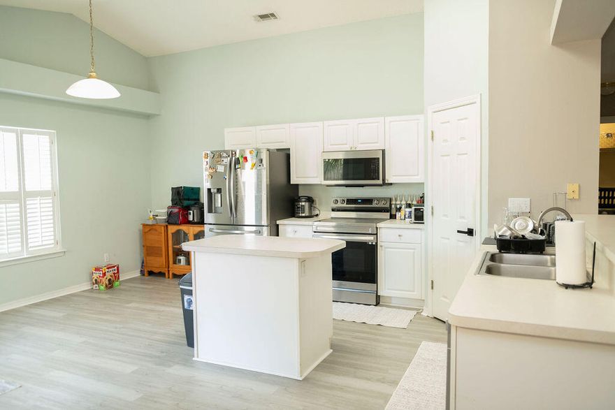 Tucked away in the peaceful Hidden Shores neighborhood, this cozy 3-bedroom, 2-bath home offers 1,867 square feet of comfortable living space with a beautiful lake view right in your backyard.Inside, you'll find an open floor plan with vaulted ceilings and fresh interior paint throughout. The entire home features durable and stylish LVP flooring, and there's even extra flooring stored in the garage for any future repairs--making upkeep easy and stress-free.The kitchen includes a handy breakfast bar that opens into the living space--great for everyday living or entertaining. Out back, a covered patio gives you a perfect spot to relax and enjoy the view of the lake.This home has been well cared for and is truly move-in ready. If you're looking for a quiet, lakefront lifestyle with with low maintenance and plenty of charm. Come check it out! 

**Home open to VA Assumption loan!!! Great interest rate, please reach out!**