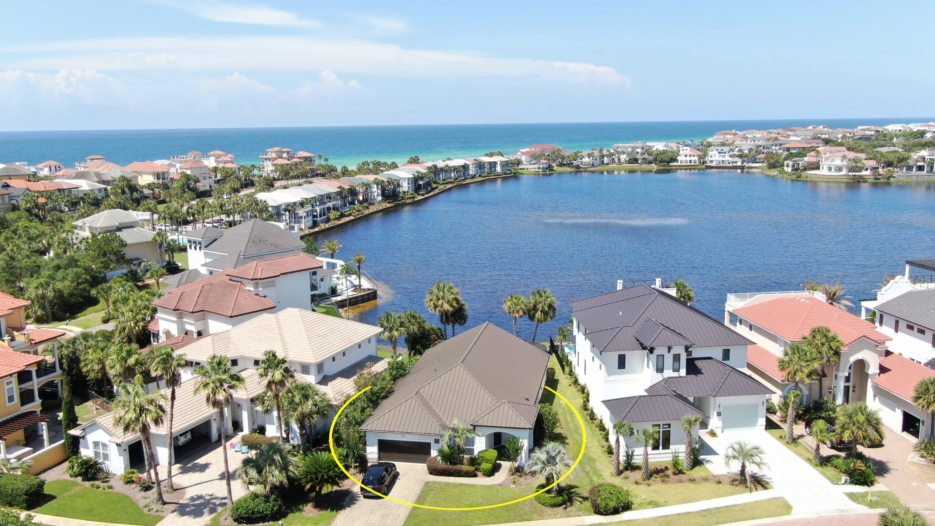 Discover your ideal lakefront getaway in the gated community of Destiny East. This fully furnished, single-story home offers 4 bedrooms, 3 bathrooms, 2,323 sq ft of beautifully renovated living space -- all set on 45 feet of serene Four Prong Lake frontage just a block away from the Beach. Enjoy fresh updates including new paint, lighting, porcelain tile floors, and charming shiplap accents.Wake up to palm trees and tranquil lake views, swim in the screened pool, or relax in the soaking tub after a day at the beach.The open backyard features both covered and sunny areas -- perfect for lounging, grilling, or outdoor dining. Inside, the kitchen shines with a built-in oven, French-door fridge, farmhouse sink, and wood-look tile floors. The adjacent dining area offers lighted display cabinets for added style.
Unwind in the cozy living room with fireplace and pool views. The spacious primary suite includes lake views, a luxurious bath with soaking tub, dual sinks, and direct pool access.
All bathrooms have updated granite countertops and cabinetry.
This home has a strong rental history, with many returning guests and limited showing availability due to high occupancy.
Brand new HVAC.
Destiny East amenities include a lagoon-style pool just steps away, tennis/pickleball courts, a putting green, playground, fitness center, and easy access to the Gulf's sugar-white sands, beachfront dining, and local attractions.
Whether you're looking for a full-time residence, vacation home, or proven investment, this lakefront gem offers it all. Contact me today to schedule your private showing!
