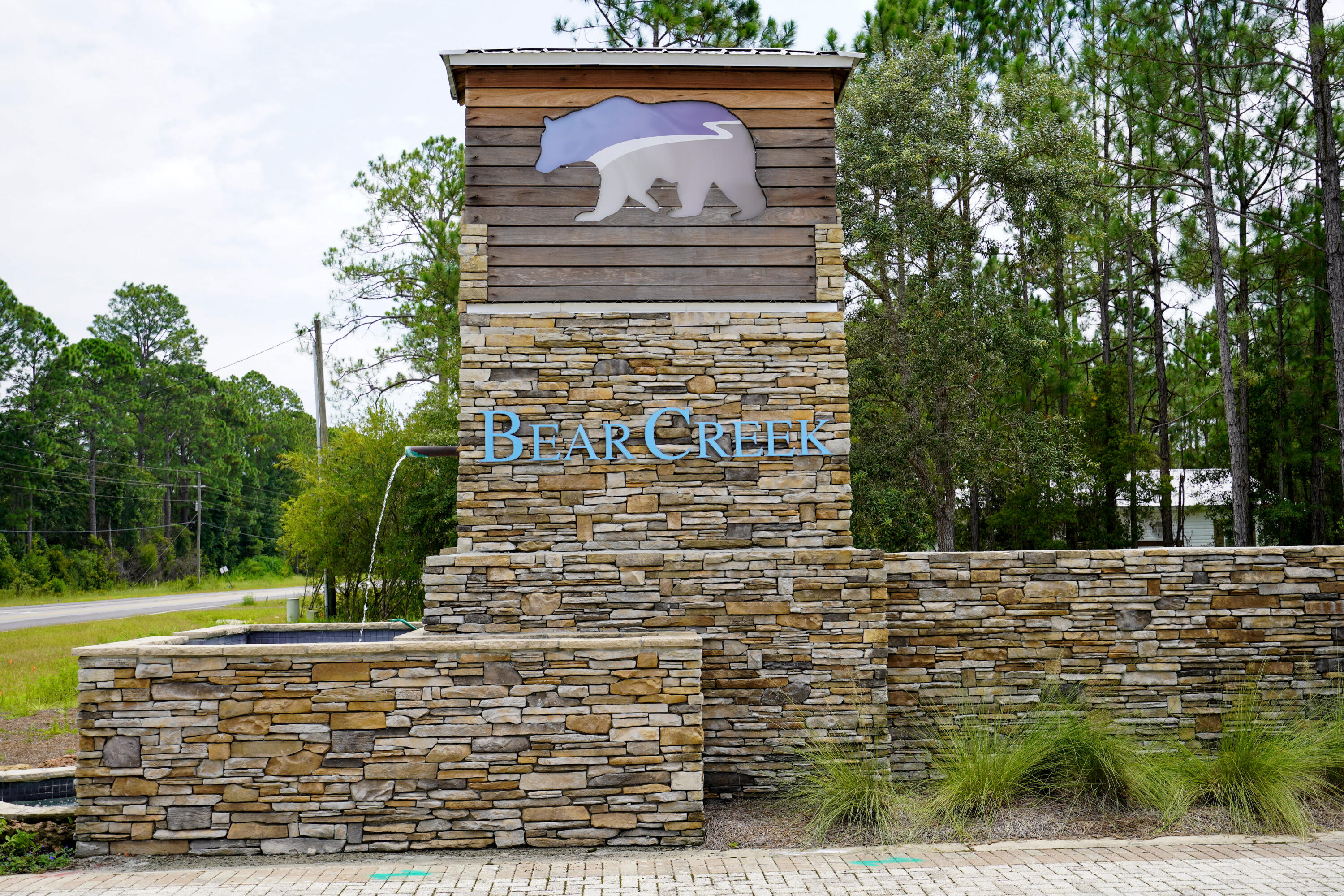 Premium vacant homesite in the gated community of Bear Creek in Freeport, FL. This oversized lot has a natural buffer behind it for added privacy. The neighborhood includes a swimming pool, fitness center, tennis courts, and pickleball courts. Bear creek is convenient the the Emerald Coast and the popular 30A area.
