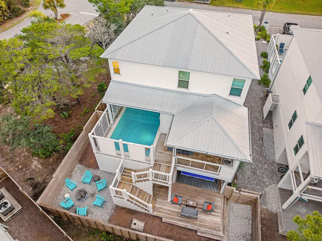 Discover a luxurious coastal retreat at 66 Seabreeze Trail, an exquisite two-story residence in Seacrest, strategically positioned a stones-throw away from the public beach access. This 5-bedroom, 5.5-bath masterpiece, constructed in 2020, seamlessly blends upscale design with the allure of beachside living.As you step into this meticulously crafted home, you'll be greeted by cozy furnishings, upgraded hardware, and a host of top-tier appliances and decor, creating an atmosphere of refined elegance. The allure extends beyond the interior, with resort-like amenities including a heated pool, a captivating sofa swing, and a plethora of entertainment options such as ping pong, air hockey, darts, and cornhole in the expansive outdoor entertainment space.Two master bedrooms, each boasting an en-suite bath, and a bunk room that sleeps 6 for the kids allows comfort and functionality coexist seamlessly. The second-floor wet bar, complete with a sink and fridge, adds a touch of sophistication to your entertaining endeavors. Notably, this property stands out as a rare gem by not being governed by an HOA, offering unparalleled freedom and flexibility.
The location is unrivaled, mere moments away from the charming shops of Alys Beach, the quaint atmosphere of Rosemary Beach, and the idyllic scenery of Seagrove Beach. Embrace the convenience of having these coveted destinations at your fingertips, promising a lifestyle defined by both sophistication and coastal charm. Currently serving as a high-end vacation rental, 66 Seabreeze Trail presents a unique opportunity to own a slice of coastal paradise. Live the 30A lifestyle to the fullest, where pristine beaches and upscale amenities surround you, and every detail of this remarkable home is crafted for an extraordinary living experience.