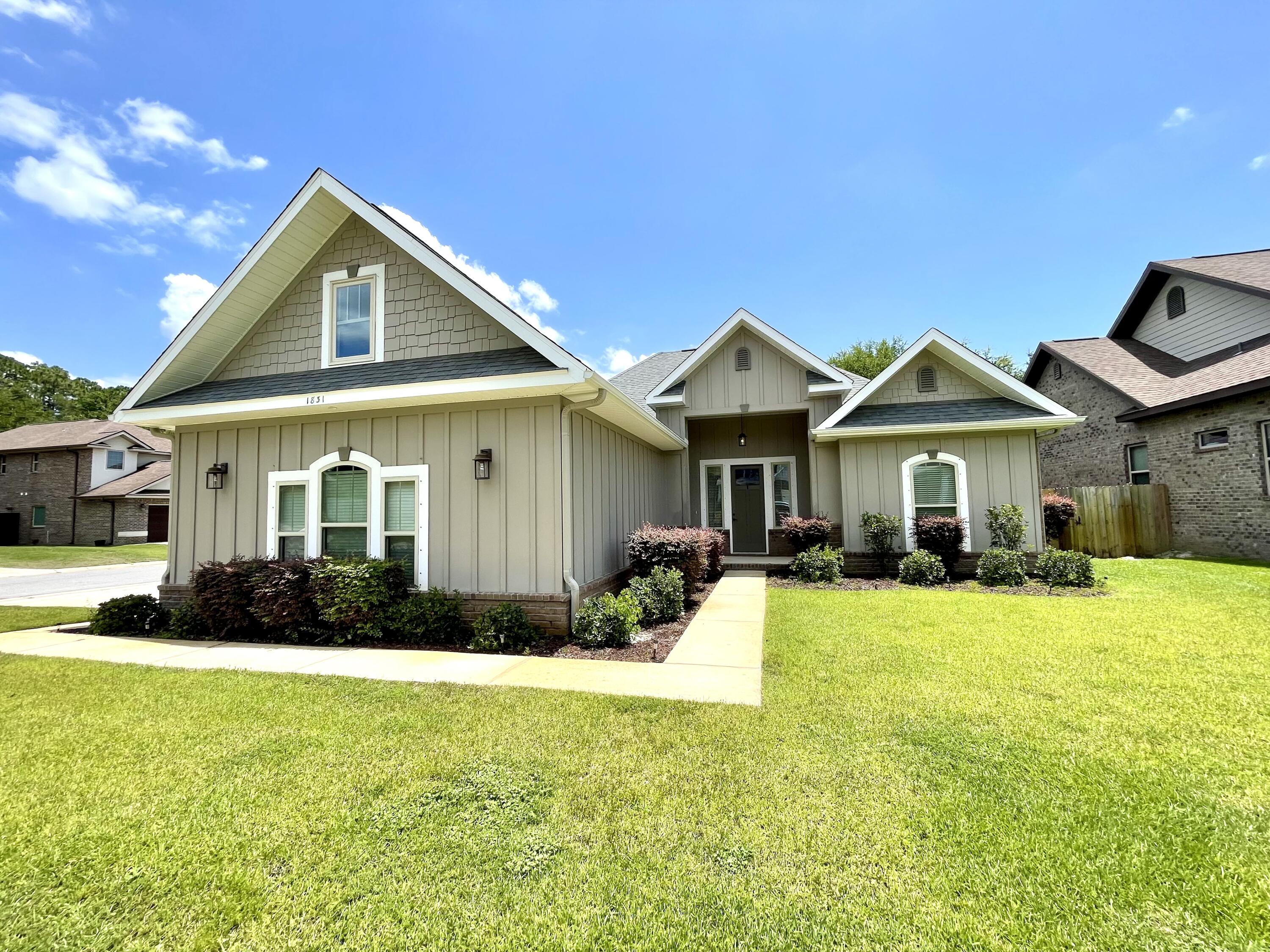Gorgeous Craftsman-style home blending comfort and elegance, move-in ready on the peaceful sound side of Hwy 98. This corner lot gem features great curb appeal and a side-entry garage. Inside, the bright open-concept living area features wood-look tile flooring and an electric fireplace for warmth and ambiance. The modern kitchen shines with stainless steel appliances, custom soft-close cabinets, ample counter space, and a spacious island--perfect for entertaining. The master suite offers a luxurious en-suite bath with a garden tub, separate shower, and dual vanity areas. Enjoy a fenced backyard with a covered patio and shaded hardscape. Paid-off solar panels keep energy bills low. Don't miss out--schedule your tour today!
