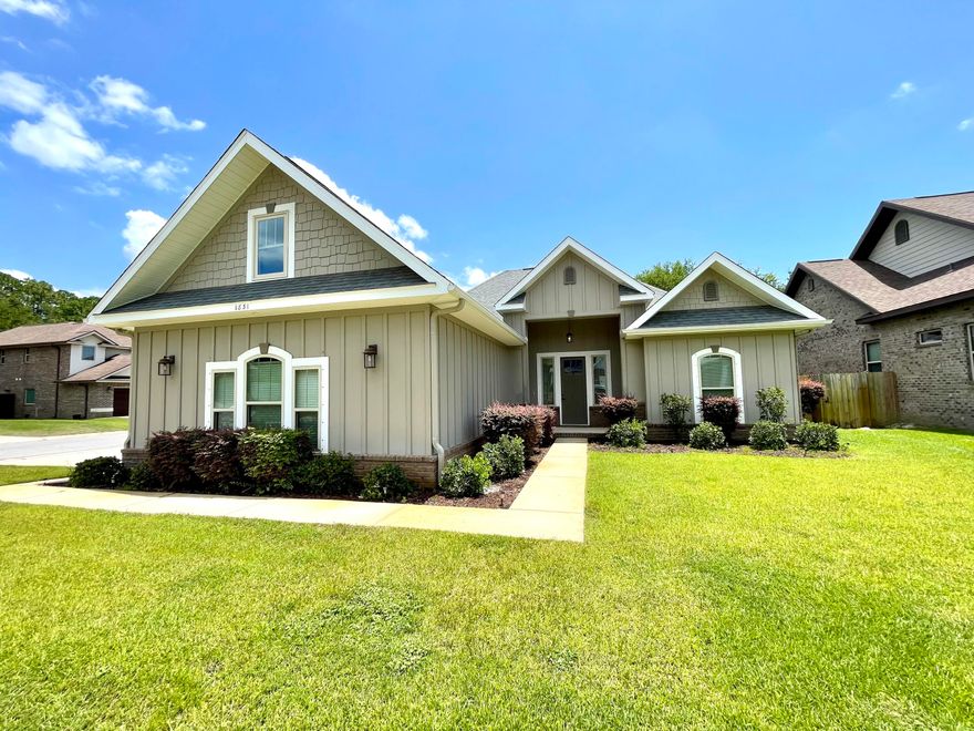 Gorgeous Craftsman-style home blending comfort and elegance, move-in ready on the peaceful sound side of Hwy 98. This corner lot gem features great curb appeal and a side-entry garage. Inside, the bright open-concept living area features wood-look tile flooring and an electric fireplace for warmth and ambiance. The modern kitchen shines with stainless steel appliances, custom soft-close cabinets, ample counter space, and a spacious island--perfect for entertaining. The master suite offers a luxurious en-suite bath with a garden tub, separate shower, and dual vanity areas. Enjoy a fenced backyard with a covered patio and shaded hardscape. Paid-off solar panels keep energy bills low. Don't miss out--schedule your tour today!