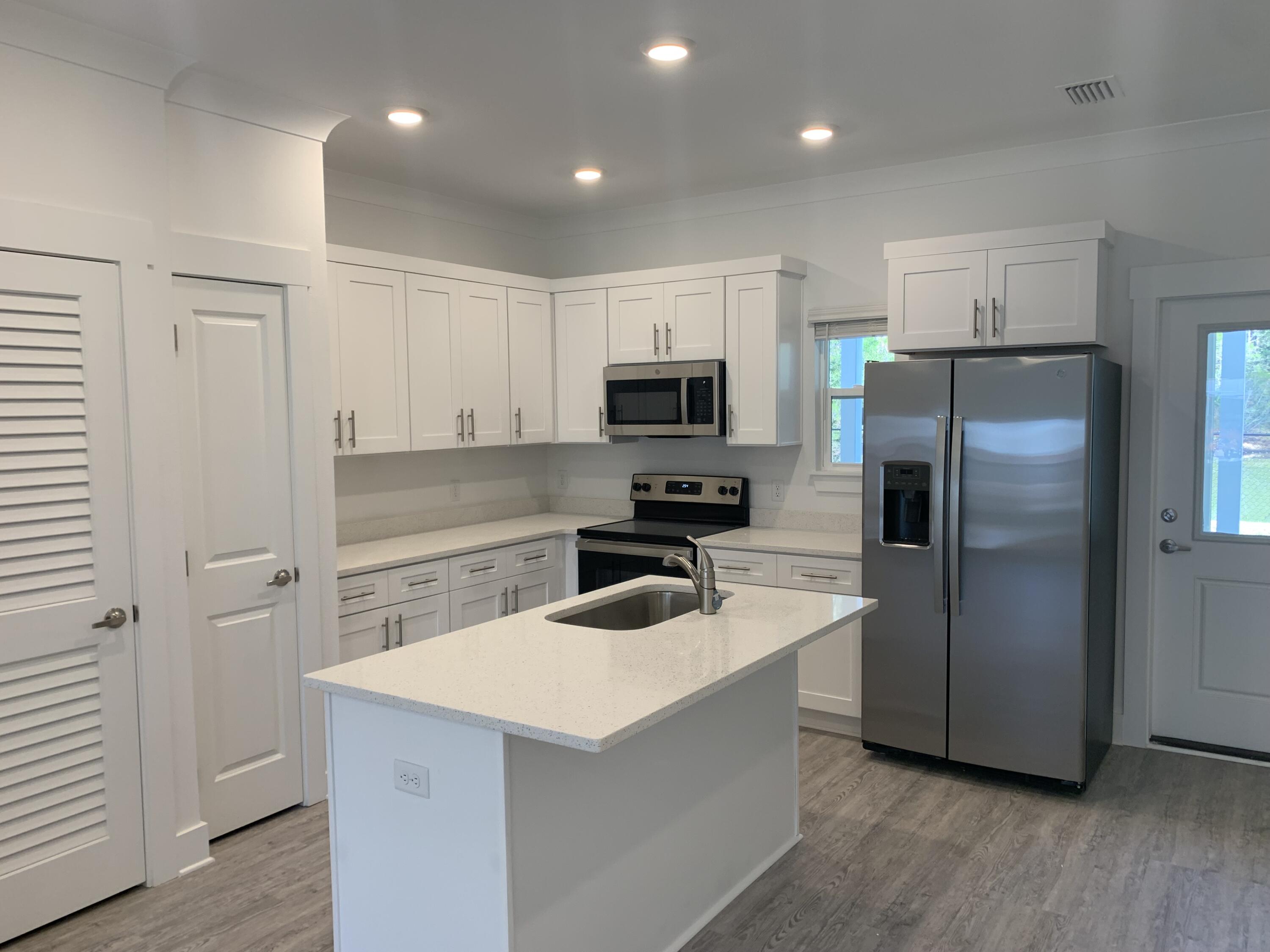 One year old townhome! Located just 20 minutes from the white sand beaches of 30A, only 25 Minutes to Destin and minutes from downtown Freeport! The Verandas offers great amenities such as a pool and pool house! Enjoy quiet evenings on your large covered patio. This LIKE NEW unit features quartz counter tops, stainless appliances, plenty of storage, large bedrooms, spacious floor plan, LVP flooring in the common areas and a separate storage closet in the patio area. Washer/dryer hookup on 2nd floor for added convenience. There are two parking spots in front of the unit. One assigned. One not assigned. Non-smoking. Pets allowed. Trash and lawn care inc. No lease fee. No hidden fees. NO MANAGEMENT APPLICATION FEES. FREE 24 hr maintenance. Managed by local Owner. Tenant to verify all info