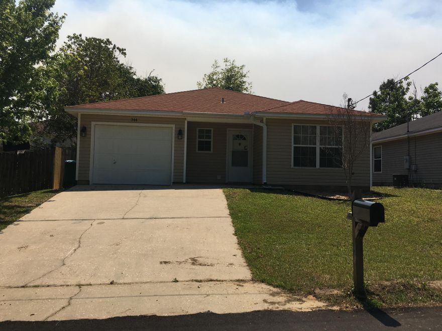 3b/2b House located south of I-10 off PJ Adams Road. This house has recently been painted, new carpet and is ready for occupancy. The sliding door in the dining area opens onto a covered patio within a private fenced yard. There is plenty of room for a vegetable garden, grill area and a swing set.The galley style kitchen is complete with stove, fridge, dishwasher, garbage disposal and built-in microwave. The one-car garage has a very nice laundry alcove with full sized washer and dryer included. The large master bathroom includes his and hers sinks and walk-in closet. The two smaller bedrooms have nice sized closets. Ceiling fans and window treatments throughout. Carpet in living area and bedrooms, ceramic tile in kitchen, dining area and bathrooms.