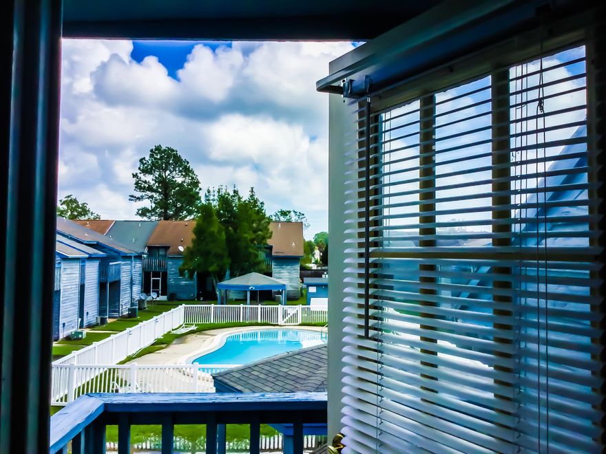 Beautifully updated / woodgrain tile on the first floor, new carpet on the second floor/tile in both bathrooms / large white kitchen with brushed nickel accessories / large walk in closet in the 15x11 master bedroom w/ balcony overlooking the swimming pool / eat-in dining area overlooking the covered back porch / updated six panel doors throughout / Plenty of natural light / move in ready / back porch looks out into pool area cort yard w/ 2 gazebos