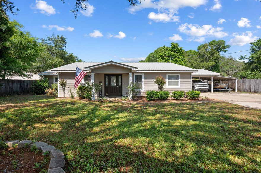 This home truly has it all—style, space, and smart upgrades!

From its charming curb appeal to the oversized carport and generous storage options, this property is designed to impress. Out back, enjoy a powered 16x24 workshop with A/C and a separate shed for yard tools—perfect for hobbies and projects.

Step inside to a beautifully renovated split floor plan with no popcorn ceilings, durable vinyl flooring throughout, and an open-concept kitchen, living, and dining area ideal for entertaining. The kitchen stuns with quartz countertops, crisp white cabinetry, newer appliances, and direct access to a spacious covered patio.

The private master suite offers a huge walk-in closet plus a second closet—ideal for organizing. Across the home, three large bedrooms provide flexibility, in including a Jack-and-Jill bath and a third full bath with a standing shower.

Outside, you'll find hardboard siding, a fully fenced backyard, and parking for three under cover.

Enjoy peace of mind with a 2011 metal roof, 2023 HVAC, PEX plumbing, copper wiring, and a 2022 water heater. Two septic tanks (one added in 2011) round out the impressive list of features.