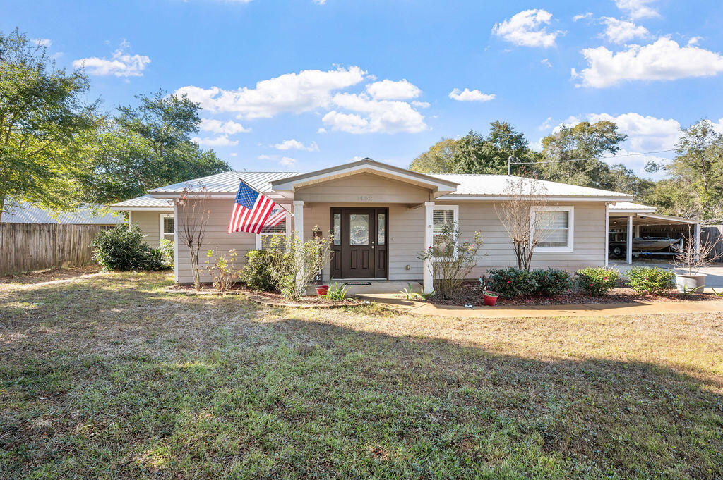 This home has it all! From charming curb appeal to practical features like ample parking, abundant storage, and dedicated spaces for your hobbies, this property is a perfect match for your needs. The backyard boasts a powered 16x24 workshop with window A/C, plus a separate shed for yard tools.Step inside to discover a beautifully renovated, open split floor plan. With no popcorn ceilings and durable vinyl flooring throughout, the home feels fresh and modern. The spacious kitchen, dining, and living areas are ideal for entertaining. The kitchen is equipped with quartz countertops, crisp white cabinets, newer appliances, and convenient access to the large, covered rear patio.The master suite is thoughtfully placed on one side of the home, offering privacy. It features a huge walk-in closet and an additional second closet, perfect for organizing multiple wardrobes. On the opposite side of the house, three generously sized bedrooms provide space for family or guests. Two of these bedrooms share a Jack-and-Jill bathroom, while the third bedroom is steps from the third bath with a standing shower.

The exterior of the home is equally impressive. It features hard-board siding, a fully fenced backyard, and a three-car covered carport. 

The home also has numerous updates for peace of mind: a 2011 metal roof, a 2023 HVAC system, PEX plumbing, copper wiring, and a 2022 water heater. Additionally, the property is serviced by two septic tanks, one of which was installed in 2011.

This home combines modern updates with timeless charm, ready to meet all your needs. Don't miss this exceptional opportunity!