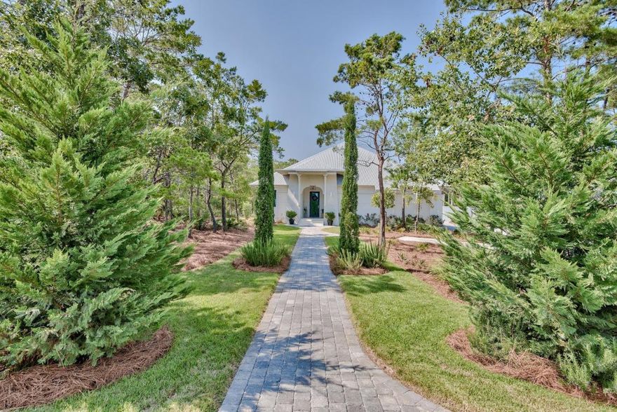 Here is your opportunity to own a one story single family home on 30A, that is situated on a 1/2 acre lot. The home backs up to a protected state forest, with a trail leading straight from your very private oasis backyard . As you pull up to the home you notice the beautifully landscaped yard and sophisticated design of the home. The foyer greets your guests with true elegance, before leading them to the main living space. The open concept is perfect for entertaining. From the living area you will notice the french doors leading you out to the outdoor living space, looking over a beautiful Grecian style pool with white pavers, and smooth stucco walled perimeter. The master bath is also a very special feature of the home, with his and her bathrooms, and two separate walk-in closets. Just