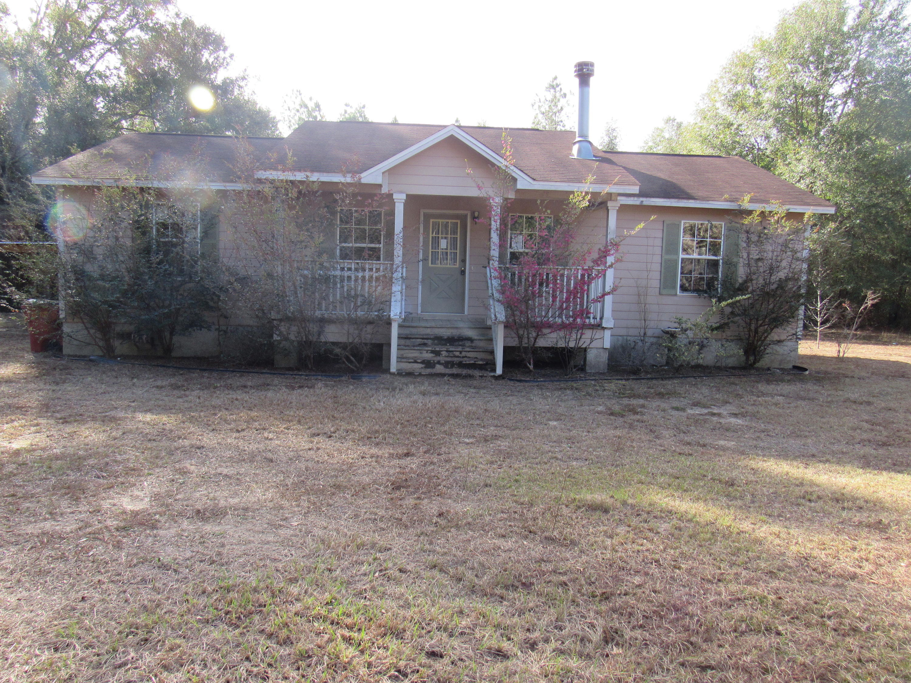 This REO home is just minutes away from I-10 in Holt and a short distance from both Crestview and Milton. Split bedroom design home was built in 2003, this home has carpet throughout, tile, and large kitchen and dining area. Outside you will find a partially fenced yard, detached garage and large wooden deck off of the back of the home. Home should qualify for most financing and a must see to appreciate. Sellers asking price: $78000.00