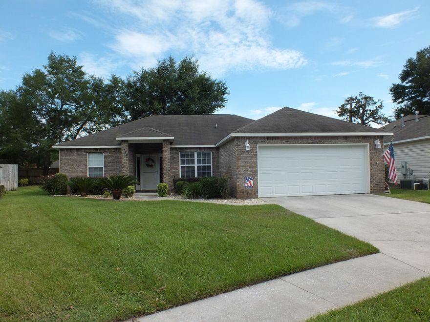 ABSOLUTELY IMMACULATE HOME..Meticulously maintained and MOVE-IN READY! Open floor plan, separate dining area, breakfast nook, split-bedroom plan for adult privacy. Huge, heated and cooled, light and bright, Florida Room accessible from the living room and master bedroom. This space is so VERSATILE; it can be used as an extra dining area, TV den, or kids play area! The kitchen is open to the living room with a built in bar so the busy cook can have company or keep the kids from out under foot! Cabinets are upgraded with pull-out shelving and trash can. BEAUTIFUL trey ceilings in Living Room and Master Bedroom. Gas fireplace offers warmth and ambiance with the flick of a switch! Spacious Master Bedroom. Master Bath has separate shower and garden tub. Master Closet has built-in shelving