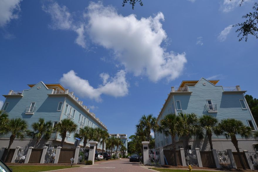 The perfect location of this 4 bedroom/4 bath Summer Place townhome is about 225 steps to Ed Walline Beach Access, Gulf Place, restaurants, and shops! This is a great investment/rental property.The top floor offers two master bedrooms with their own private baths. As you make your way to the top, the private rooftop engulfs you with its amazing Gulf Views! The community pool is only a few steps away! This lovely and elegant townhome has wood and travertine tile floors throughout. The kitchen boasts all stainless steel appliances, granite counter tops and cherry cabinets. The carpet runners on the stairs and the plantation shutters throughout the home adds that extra touch!