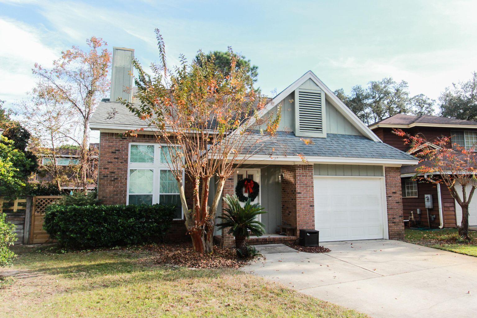 Three bedroom with brand new roof on a cul-de-sacLocated on a quiet cul-de-sac in the Crosswinds Landing in Ft. Walton Beach, this brick and wood siding home is the perfect place to call home. The open layout offers a large living room with a cozy gas fireplace (as easy as a switch!), cathedral ceilings, and tile flooring throughout the downstairs. With a full dining area leading to the kitchen and breakfast nook, seating is not a problem! Look from your kitchen through the large windows to the backyard. The kitchen, with stainless steel appliances, is separated from the dining room with a half-wall and has access to the backyard's open concrete patio through the breakfast nook.