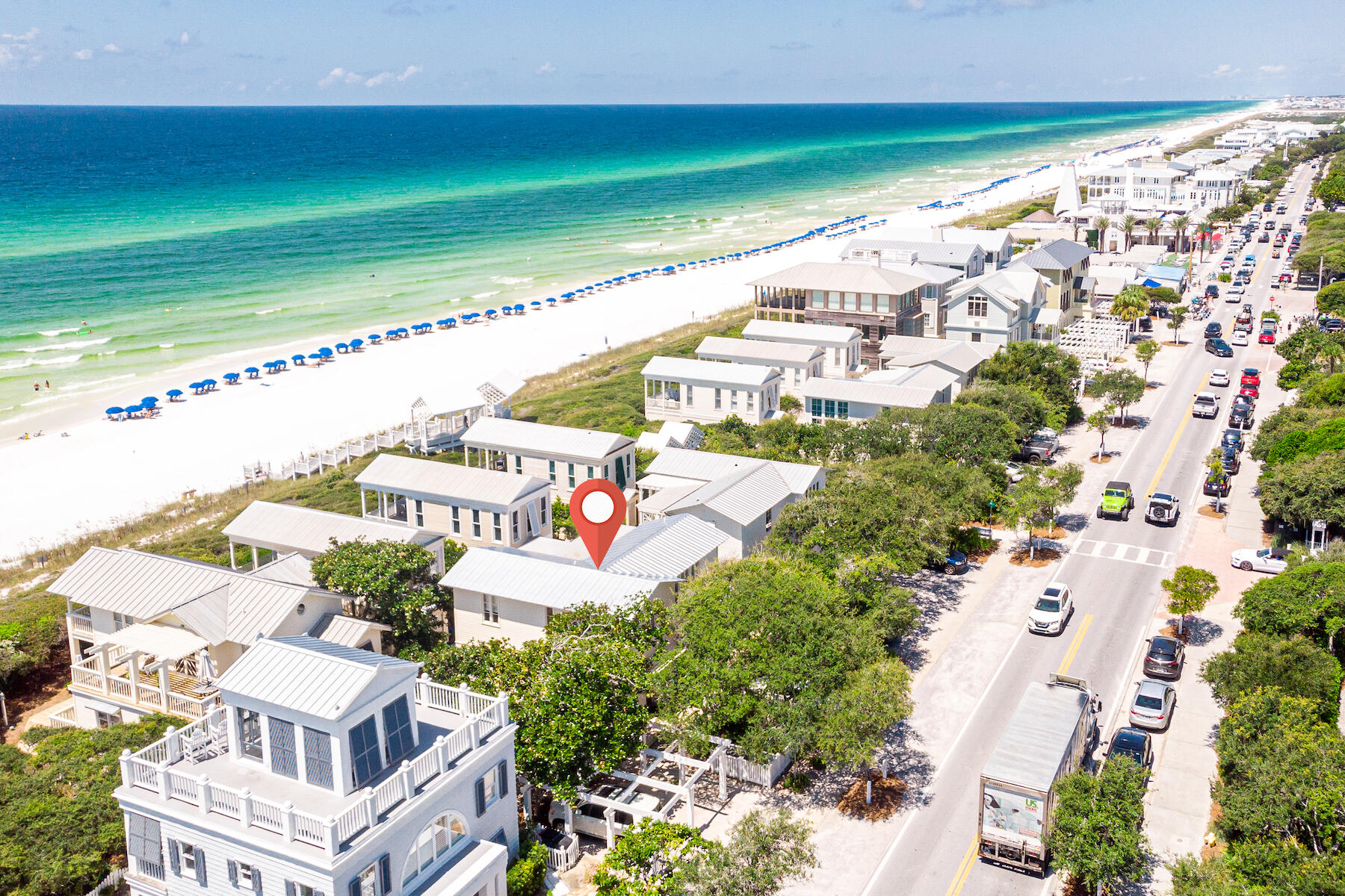 Located south of 30A and just steps to the East Ruskin Pavilion, this two-story beach cottage boasts an exceptional location with terrific gulf views. Stairs to the living area are just off the entrance foyer. Vaulted ceiling with exposed beams, built-in cabinets, floor to ceiling windows that allow plenty of light, are just a few highlights of the living room. The living area extends onto the covered porch with amazing gulf views and spectacular sunsets. The unique dining table with iron base and reclaimed pine tabletop seats six. The galley kitchen is waiting for the family chef. Stainless steel appliances include Subzero refrigerator, Wolf gas stove, KitchenAid dishwasher, and a wine refrigerator. The breakfast bar seats four. Guest suite with king bed also on second level. The