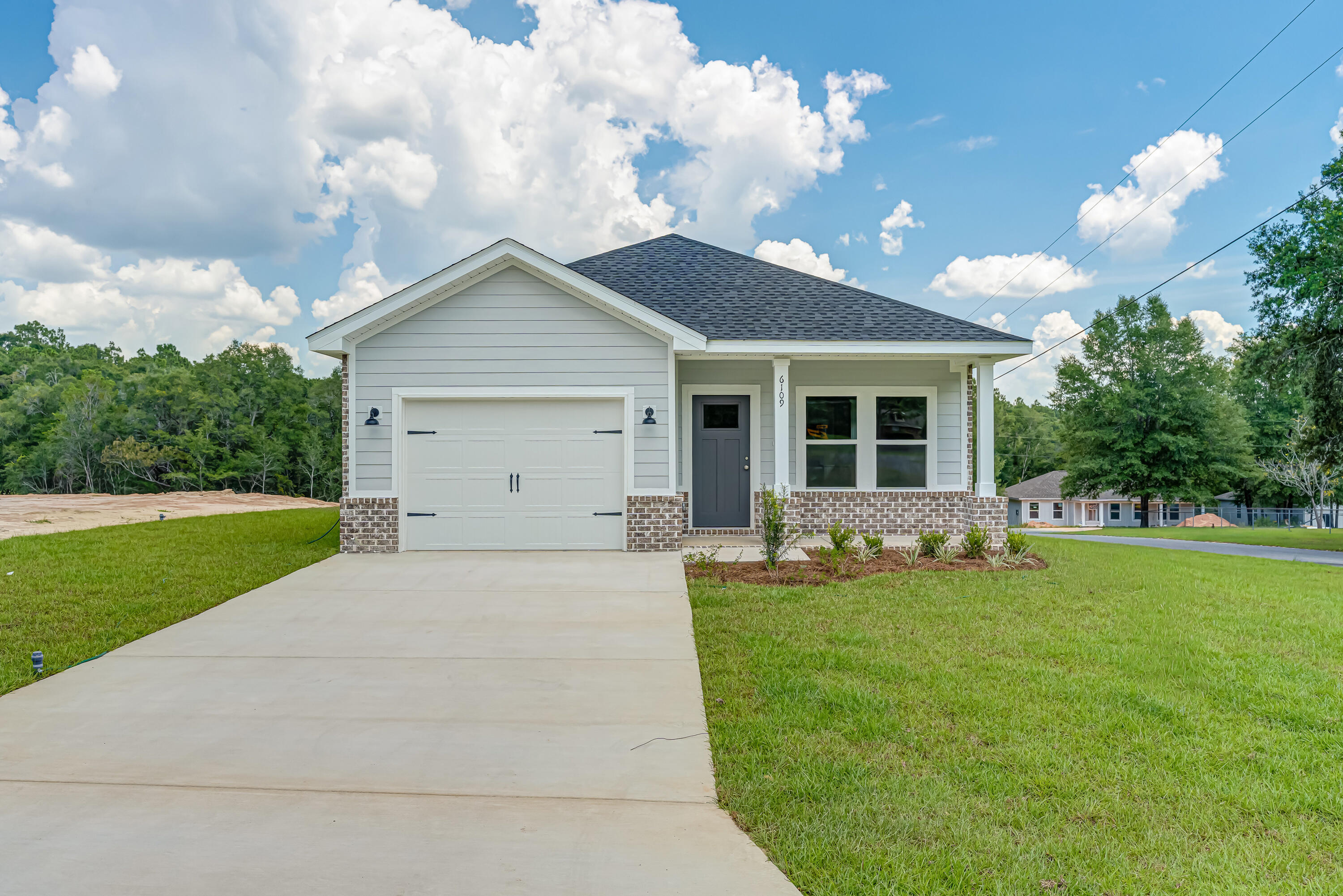 CORNER LOCATION FOR THIS NEW HOME -All brick quality construction + affordability is hard to come by but this builder makes it happen!! Standards - not upgrades include luxury vinyl plank flooring, raised ceilings, recessed lighting, quartz or granite countertops, work island, walk-in pantry, double vanities/linen storage/walk-in closet in owners bath, ceiling fans, front and rear porches for relaxing and enjoying you landscaped yard. Seller will contribute up to $10,000 towards closing costs/prepaids/rate buydown-call for details.